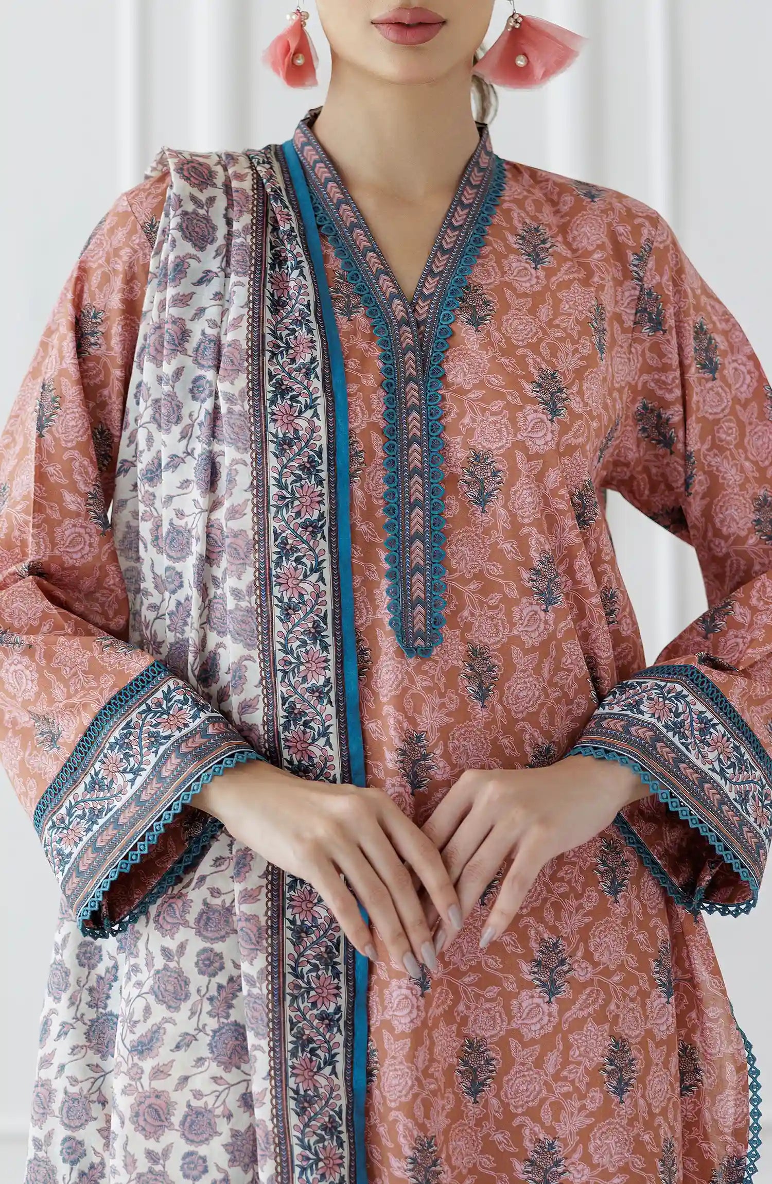 Woman wearing a pink and orange traditional outfit with a patterned dupatta on a plain trouser. Stitched Printed Lawn Shirt Dupatta & Pant - 3 Piece Suits - OTL-25-027