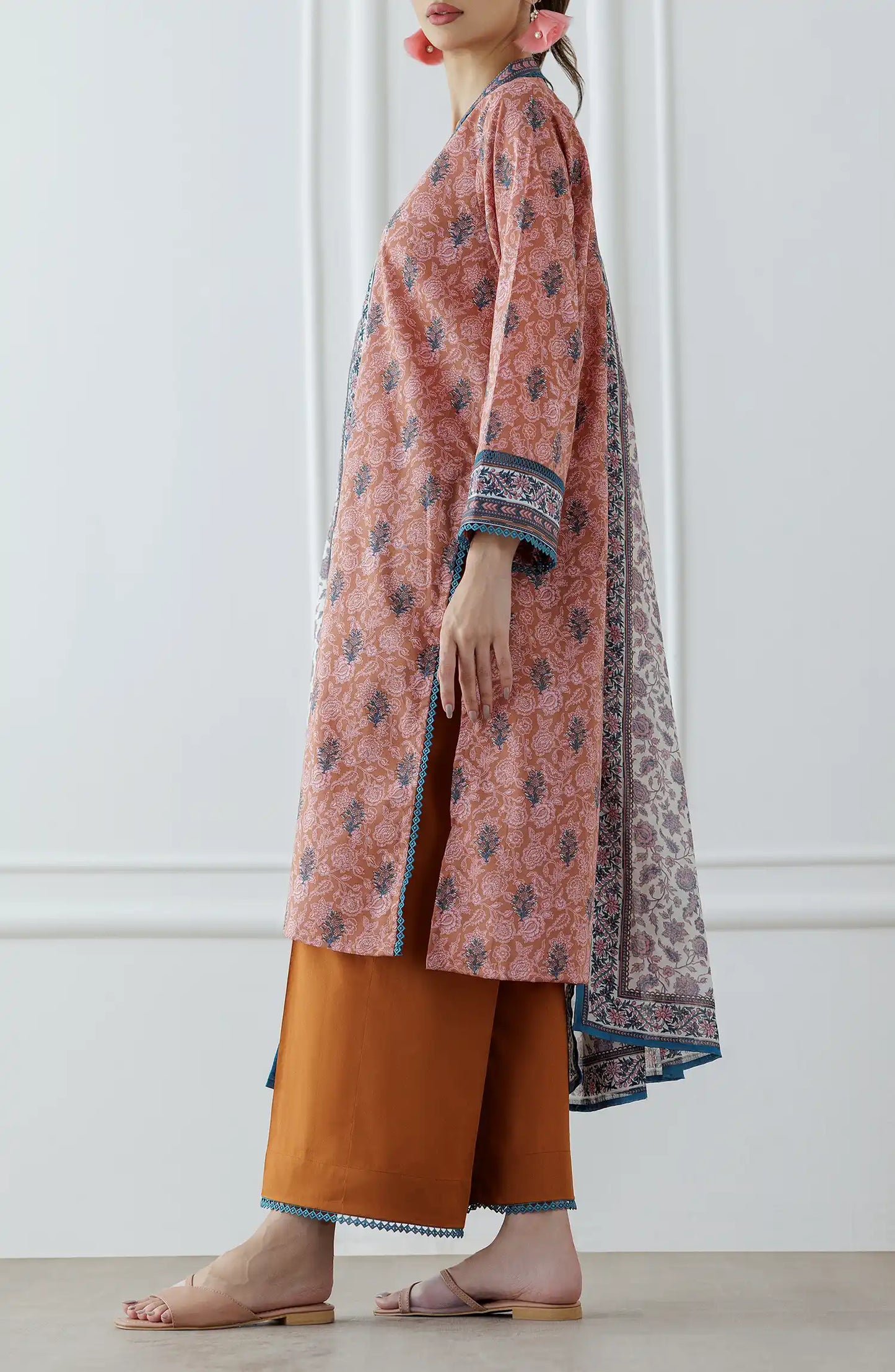 Woman wearing a pink and orange traditional outfit with a patterned dupatta on a plain trouser. Stitched Printed Lawn Shirt Dupatta & Pant - 3 Piece Suits - OTL-25-027