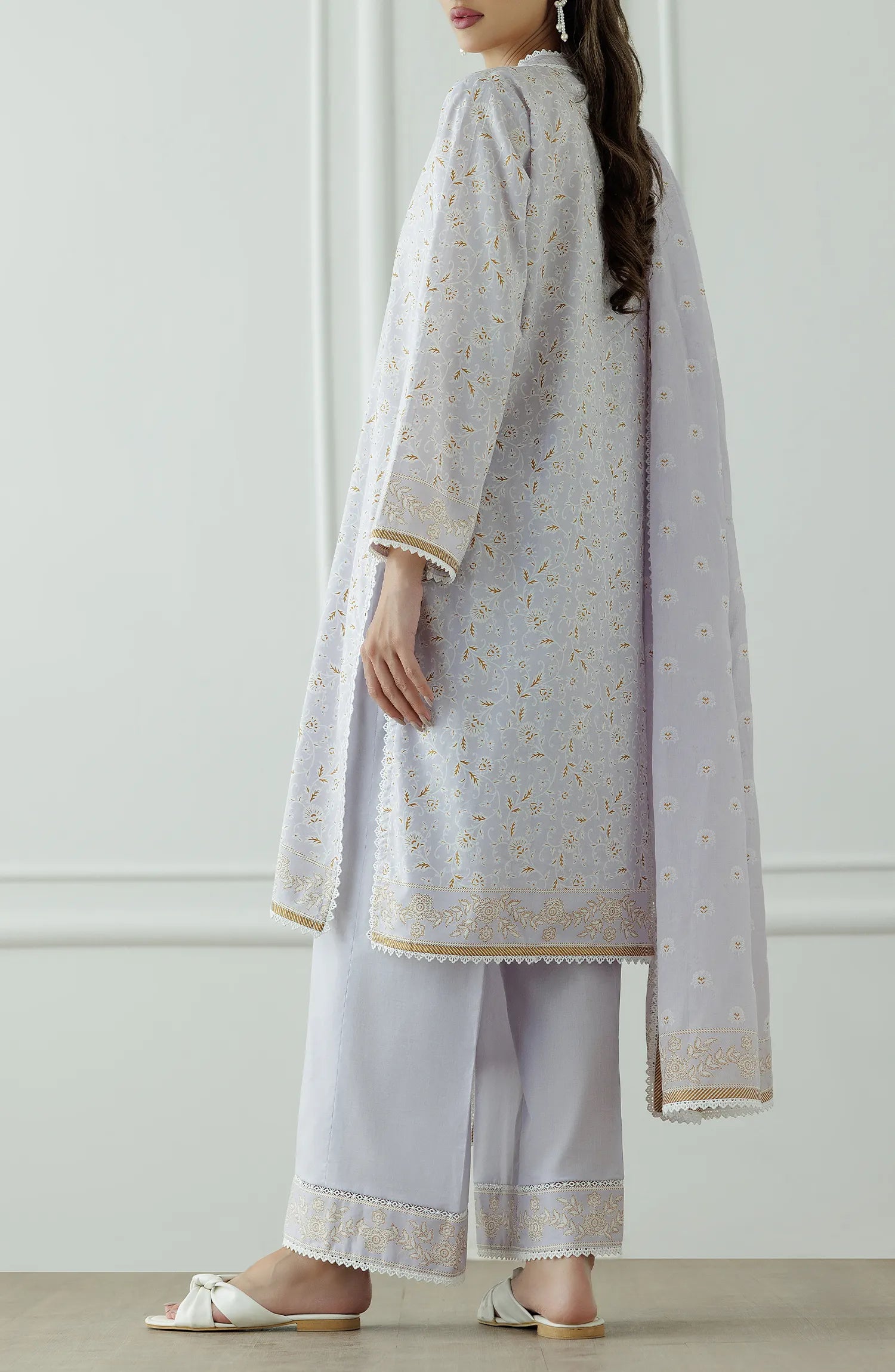 Stitched Printed Lawn Shirt Dupatta & Pant - 3 Piece - OTL-25-034. Woman wearing a light gray traditional outfit with a white dupatta against a white background