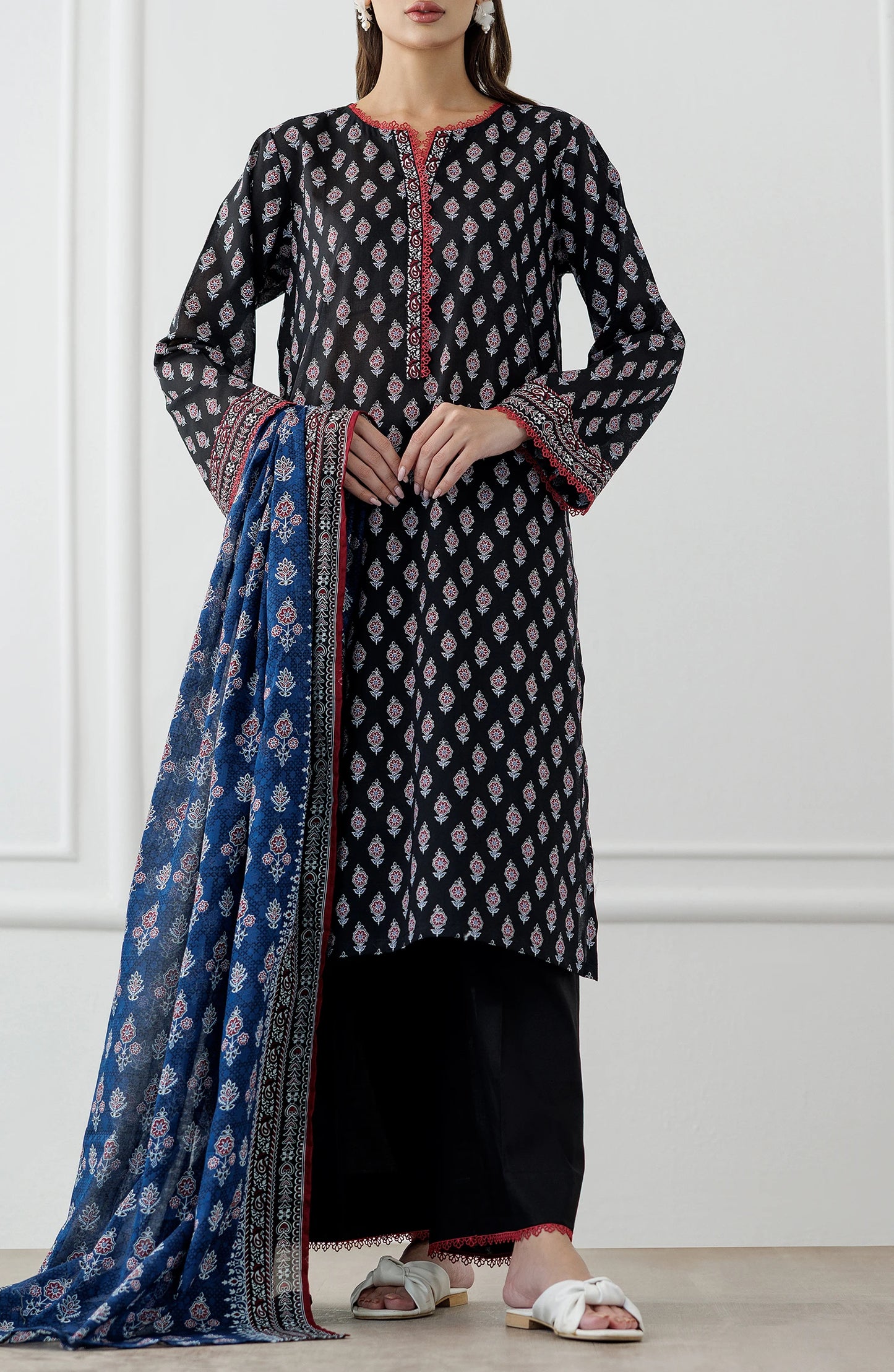 Woman wearing a black and red patterned kurta with a blue dupatta against a plain trouser. Stitched Printed Lawn Shirt Dupatta & Pant - 3 Piece Suits - OTL-25-048