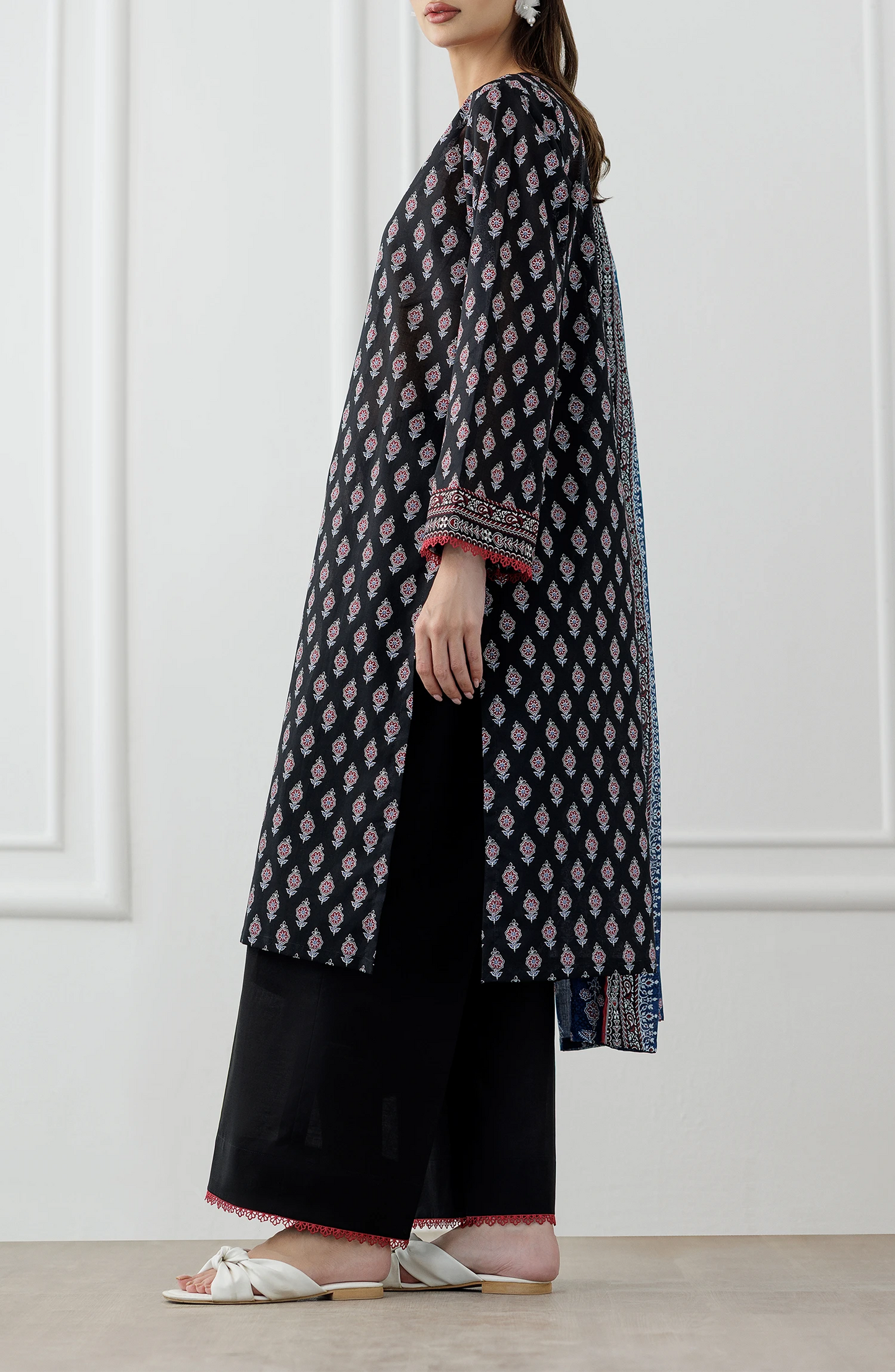 Woman wearing a black and red patterned kurta with a blue dupatta against a plain trouser. Stitched Printed Lawn Shirt Dupatta & Pant - 3 Piece Suits - OTL-25-048