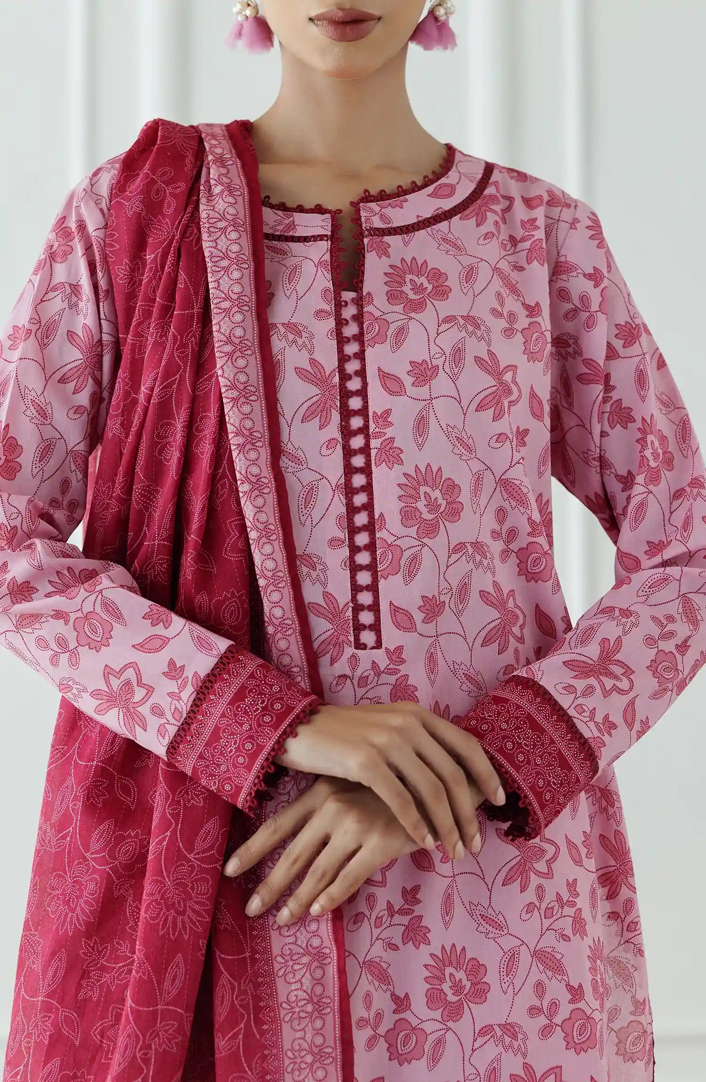 Woman wearing a pink floral kurta with a matching dupatta against a plain trouser. Stitched Printed Lawn Shirt Dupatta & Pant - 3 Piece Suits - OTL-25-058