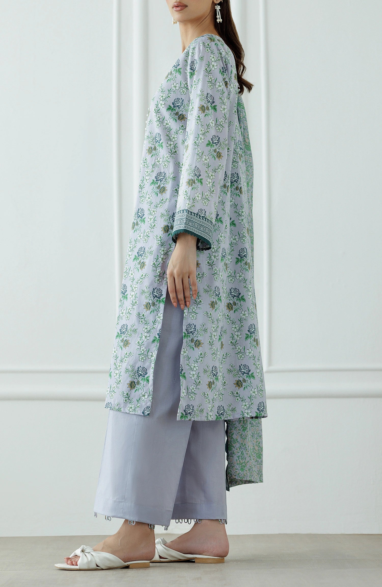 Woman wearing a floral kurta with a matching dupatta against a plain trouser. Stitched Printed Lawn Shirt Dupatta & Pant - 3 Piece Suits - OTL-25-059