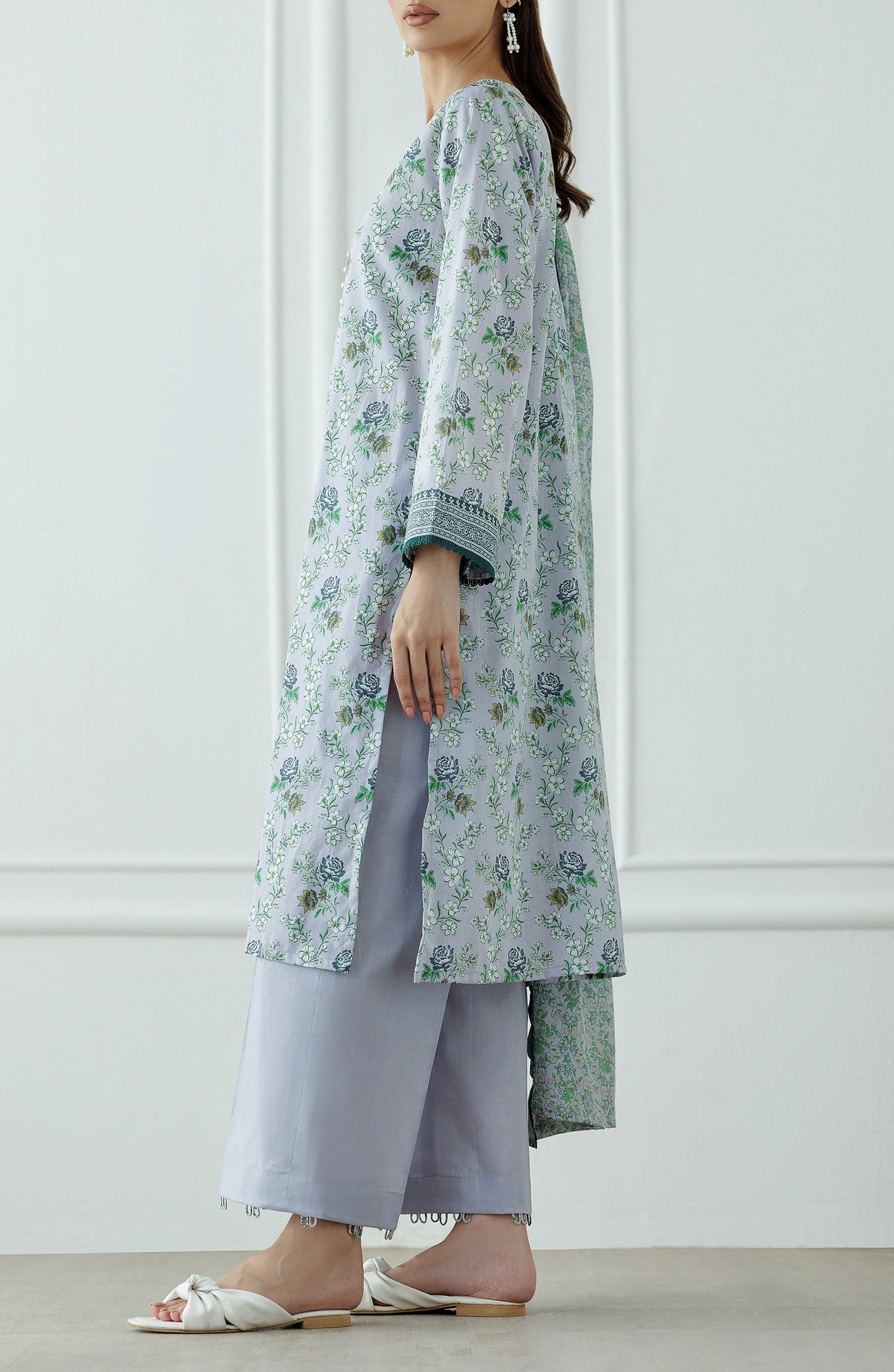 Woman wearing a floral kurta with a matching dupatta against a plain trouser. Stitched Printed Lawn Shirt Dupatta & Pant - 3 Piece Suits - OTL-25-059