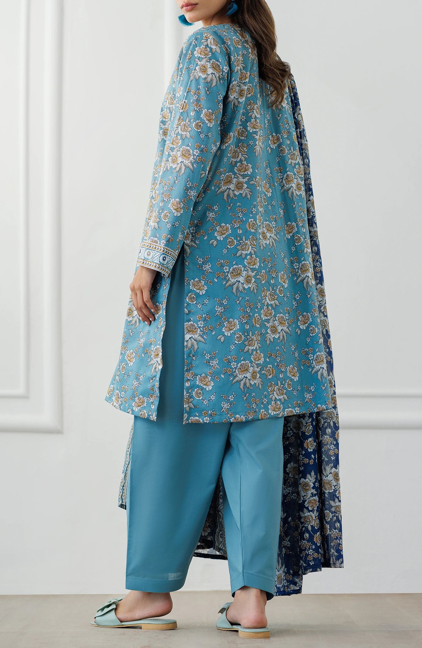 Woman wearing a blue floral outfit with matching dupatta against a plain trouser. Unstitched Printed Lawn Shirt Dupatta & Pant - 3 Piece Suits - OTL-25-070
