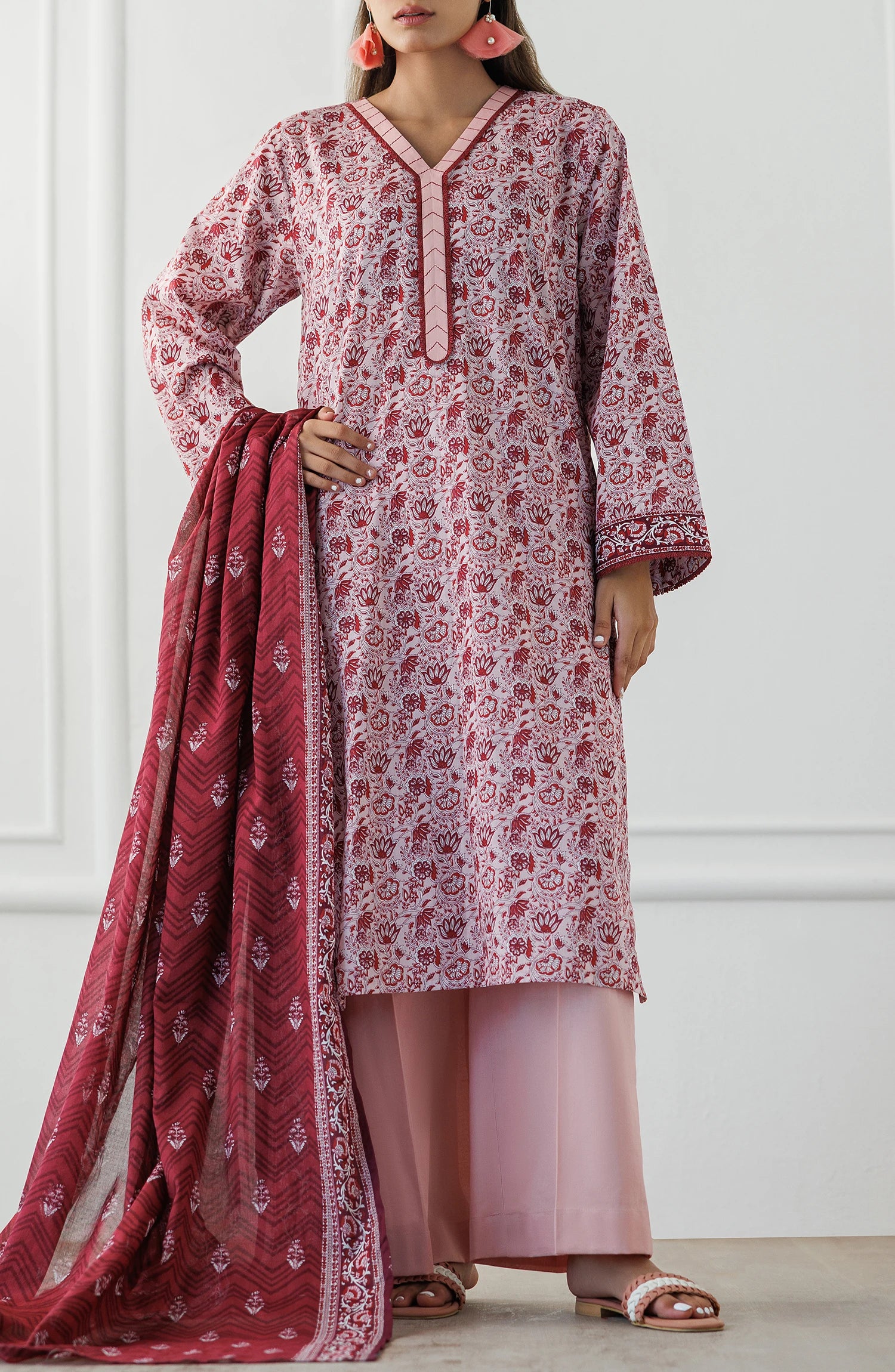 Woman wearing a pink and red floral kurta with a matching dupatta on a dyed trouser. Unstitched Printed Lawn Shirt Dupatta & Pant - 3 Piece Suits - OTL-25-071