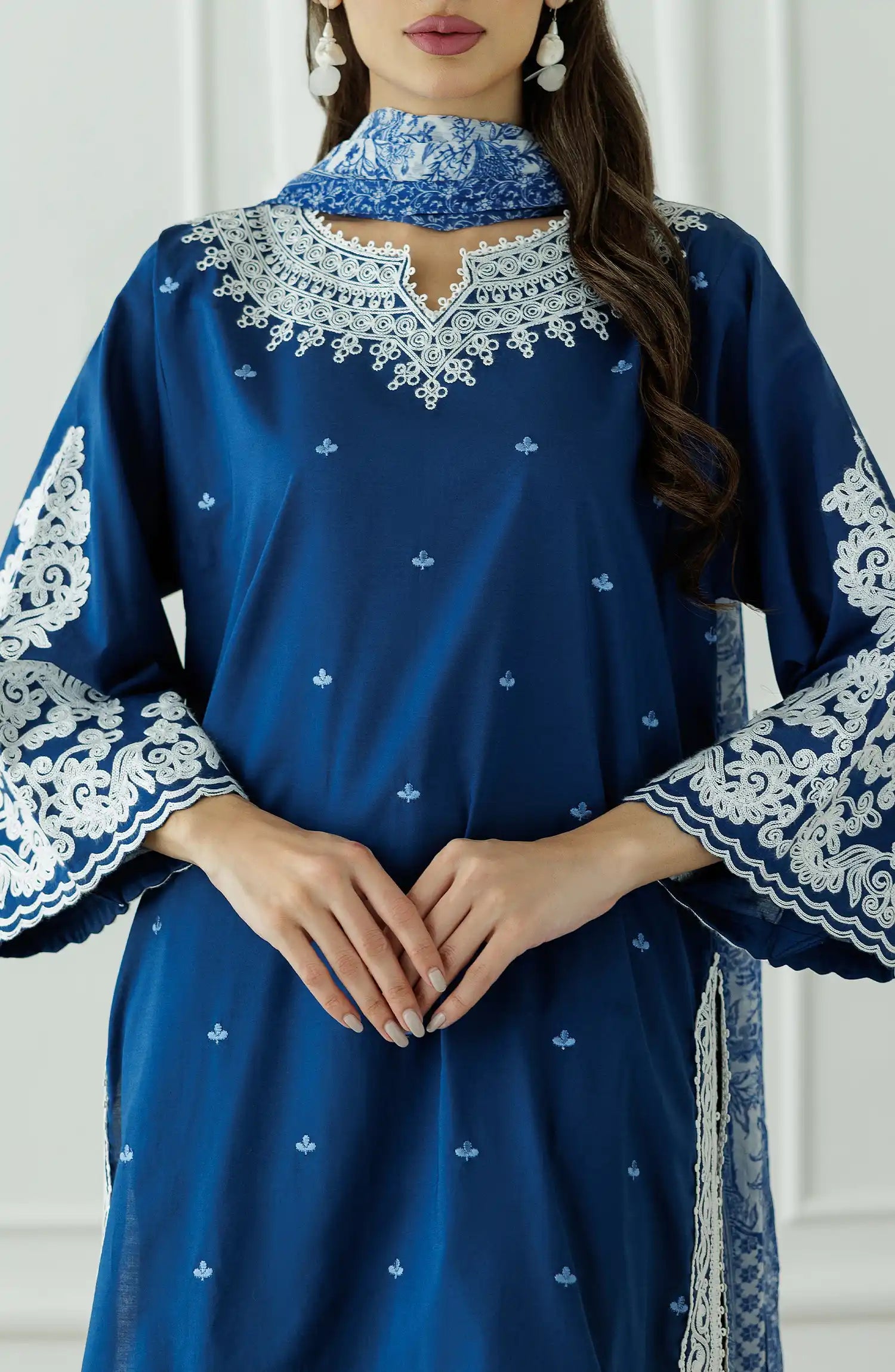 Woman wearing a blue embroidered outfit with a matching dupatta against a dyed trouser. Stitched Luxury Festive Formal Lawn Shirt Dupatta & Pant - 3 Piece Suits - OTL-25-082