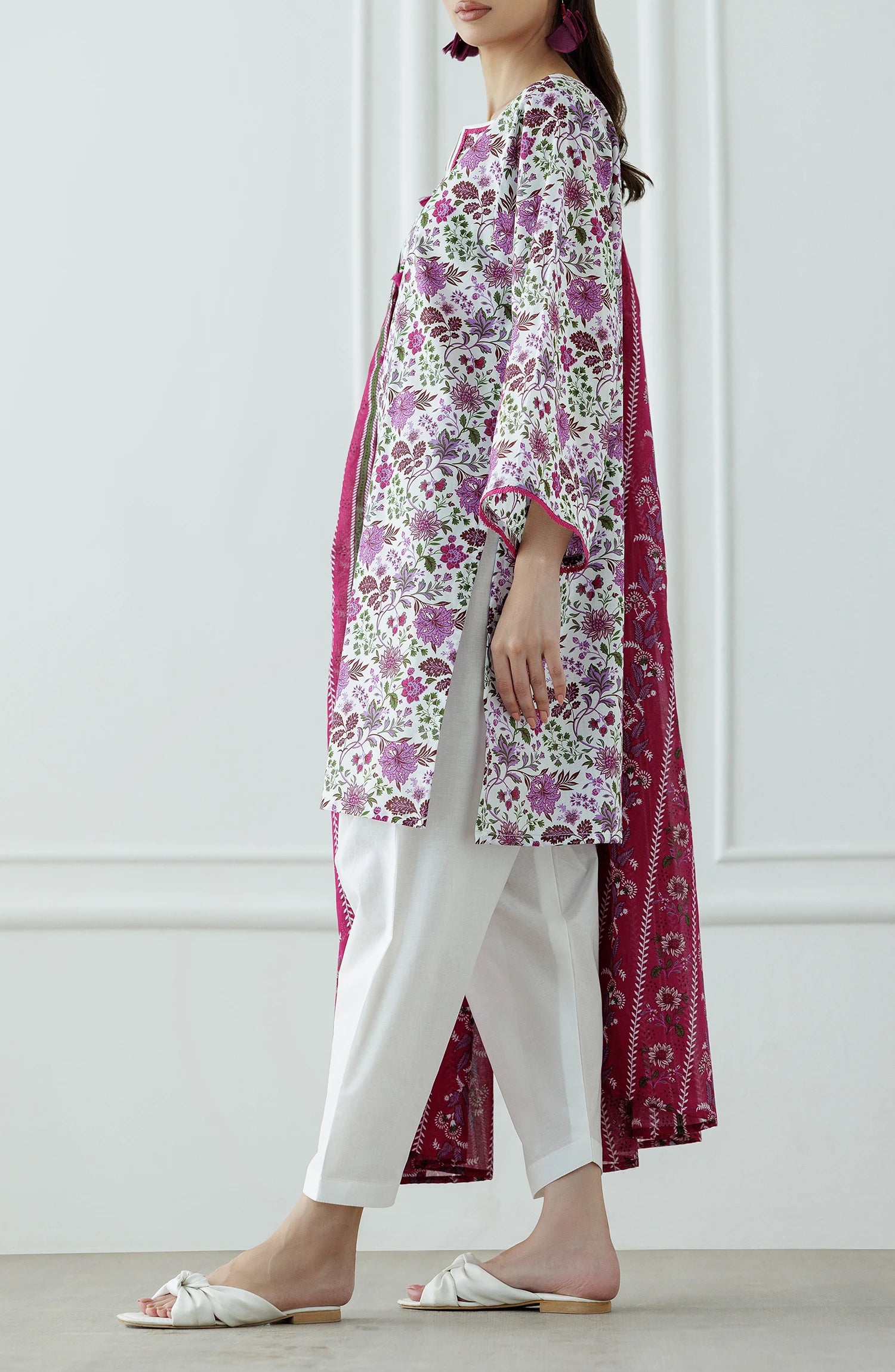 Woman wearing a floral kurta with white pants and a pink dupatta with plain shalwar trouser. Stitched Printed Lawn Shirt Dupatta & Pant - 3 Piece Suits - OTL-25-099