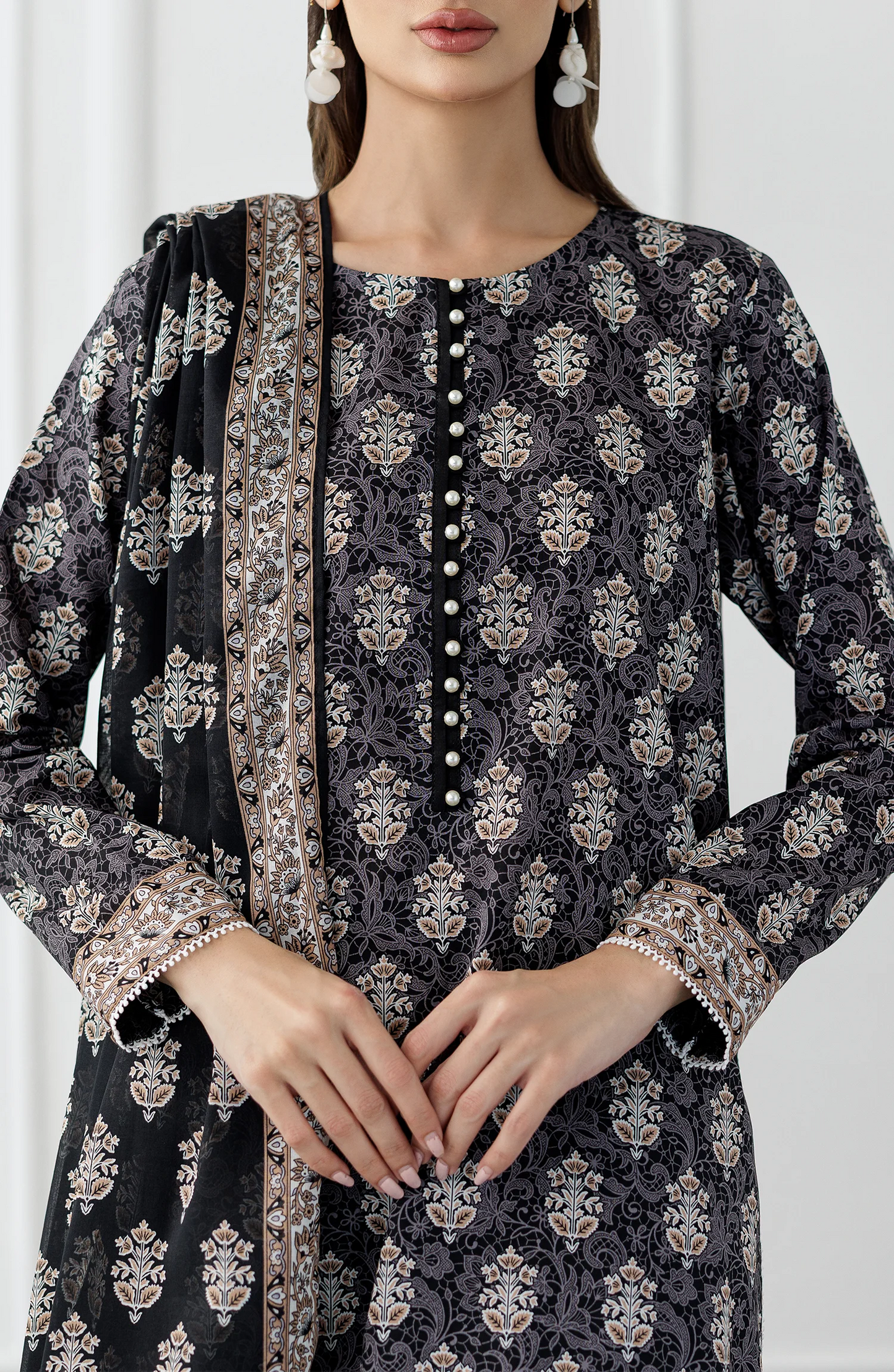 Woman wearing a black and white patterned kurta with a printed dupatta and against a dyed trouser. Stitched Printed Lawn Shirt Dupatta & Pant - 3 Piece Suits - OTL-25-105
