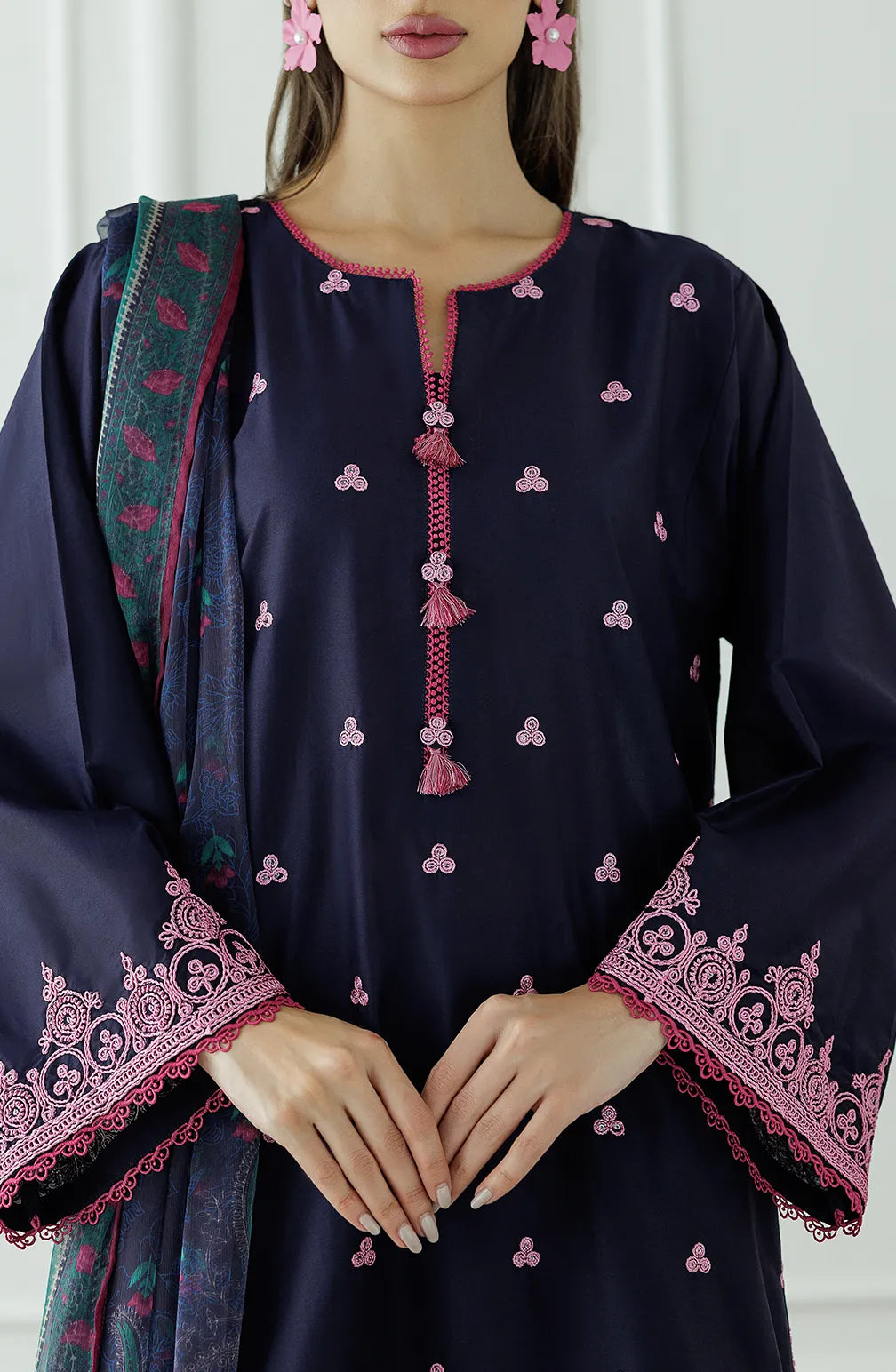 Woman wearing a navy blue traditional outfit with pink patterns, holding a matching dupatta and dyed trouser. Stitched Luxury Premium Embroidered Lawn Shirt Dupatta & Pant - 3 Piece Suits - OTL-25-132