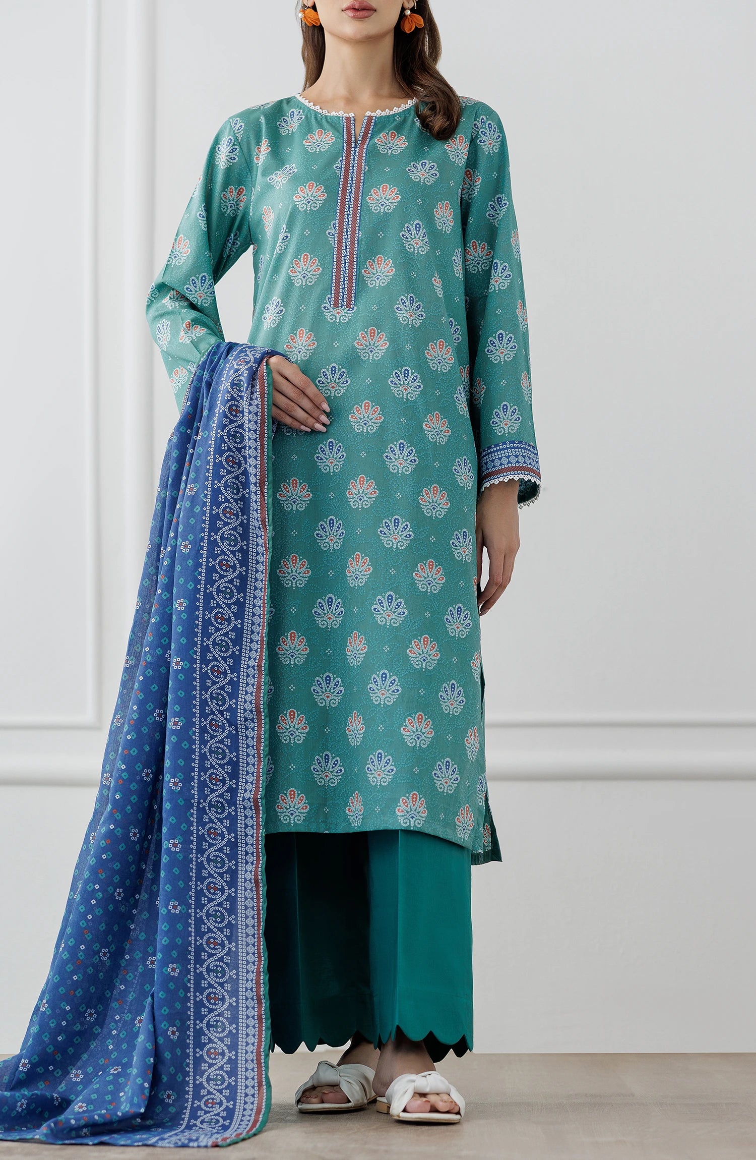 Woman wearing a teal and blue traditional. Stitched Printed Lawn Shirt Dupatta & Pant - 3 Piece Suits - OTL-25-307