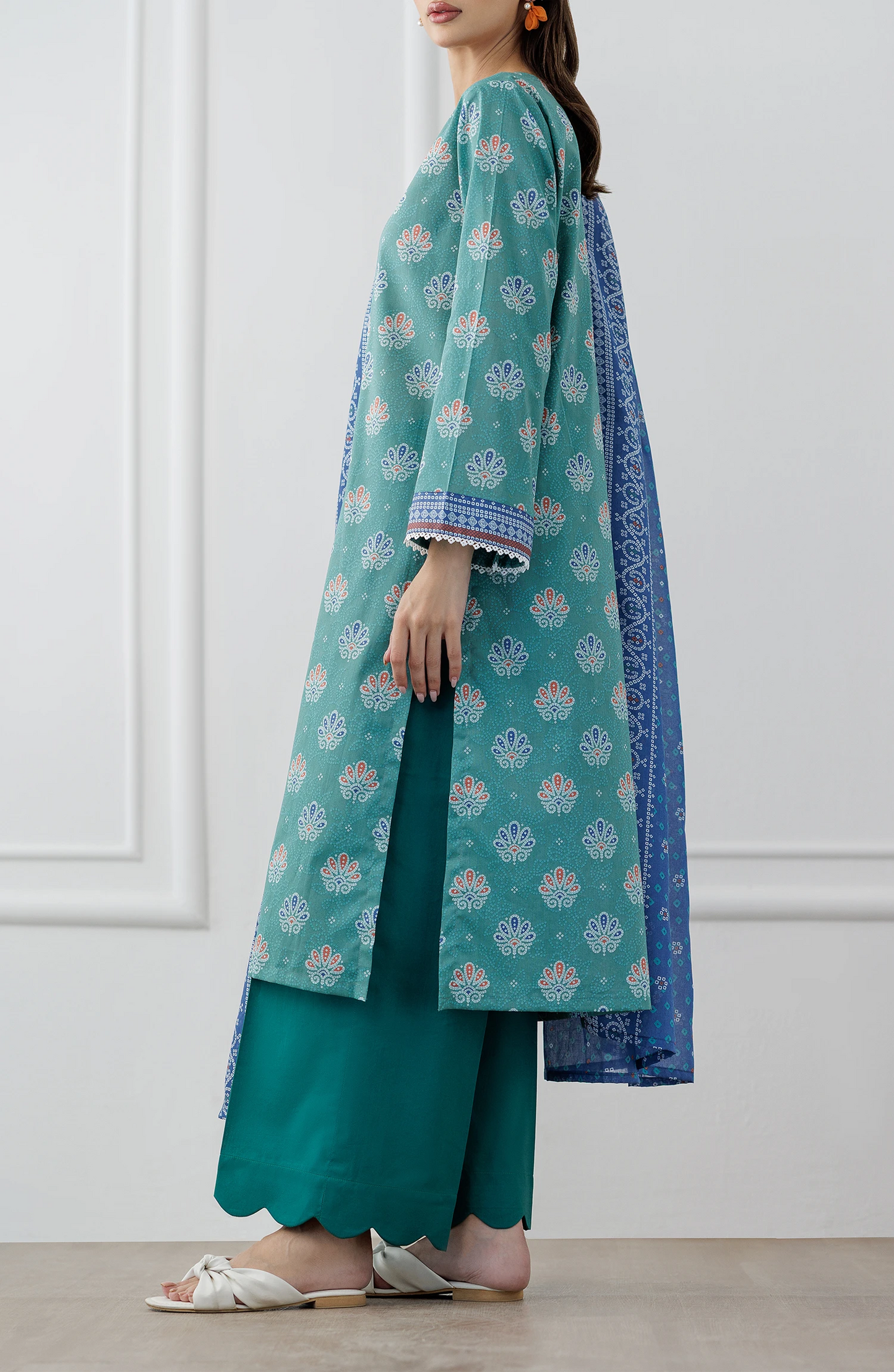 Woman wearing a teal and blue traditional. Stitched Printed Lawn Shirt Dupatta & Pant - 3 Piece Suits - OTL-25-307