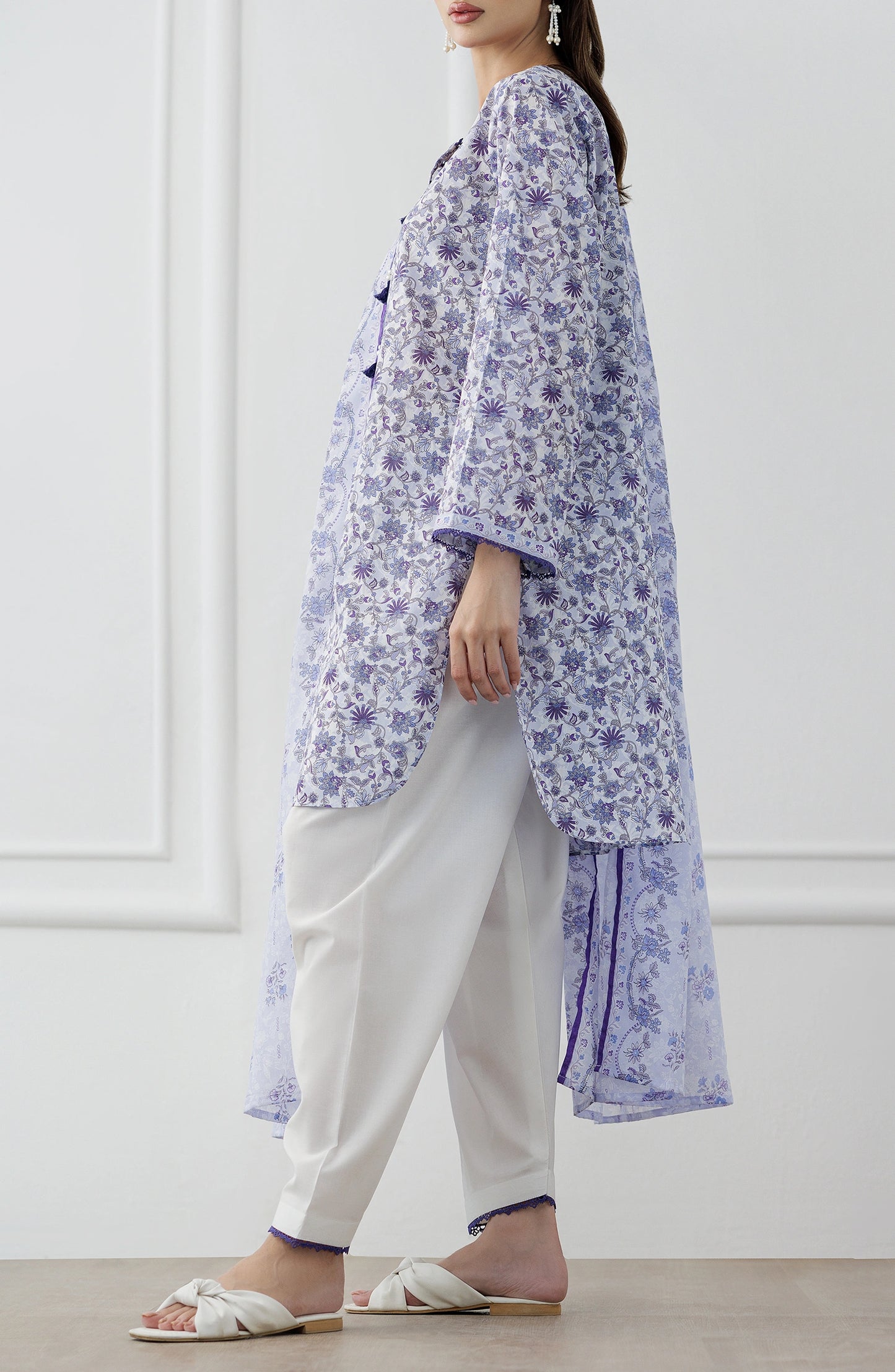 Woman wearing a blue and white floral outfit with a matching dupatta against a dyed trouser. Unstitched Printed Lawn Shirt Dupatta & Pant - 3 Piece Suits - OTL-25-312