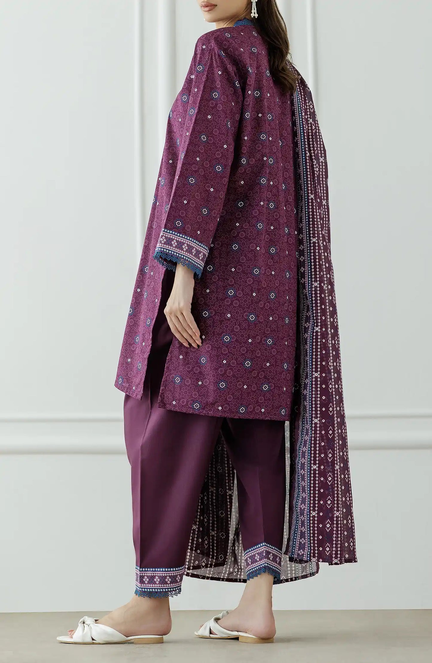 Woman wearing a purple traditional outfit with a matching dupatta against a dyed Trouser. Stitched Printed Lawn Shirt Dupatta & Pant - 3 Piece Suits - OTL-25-325