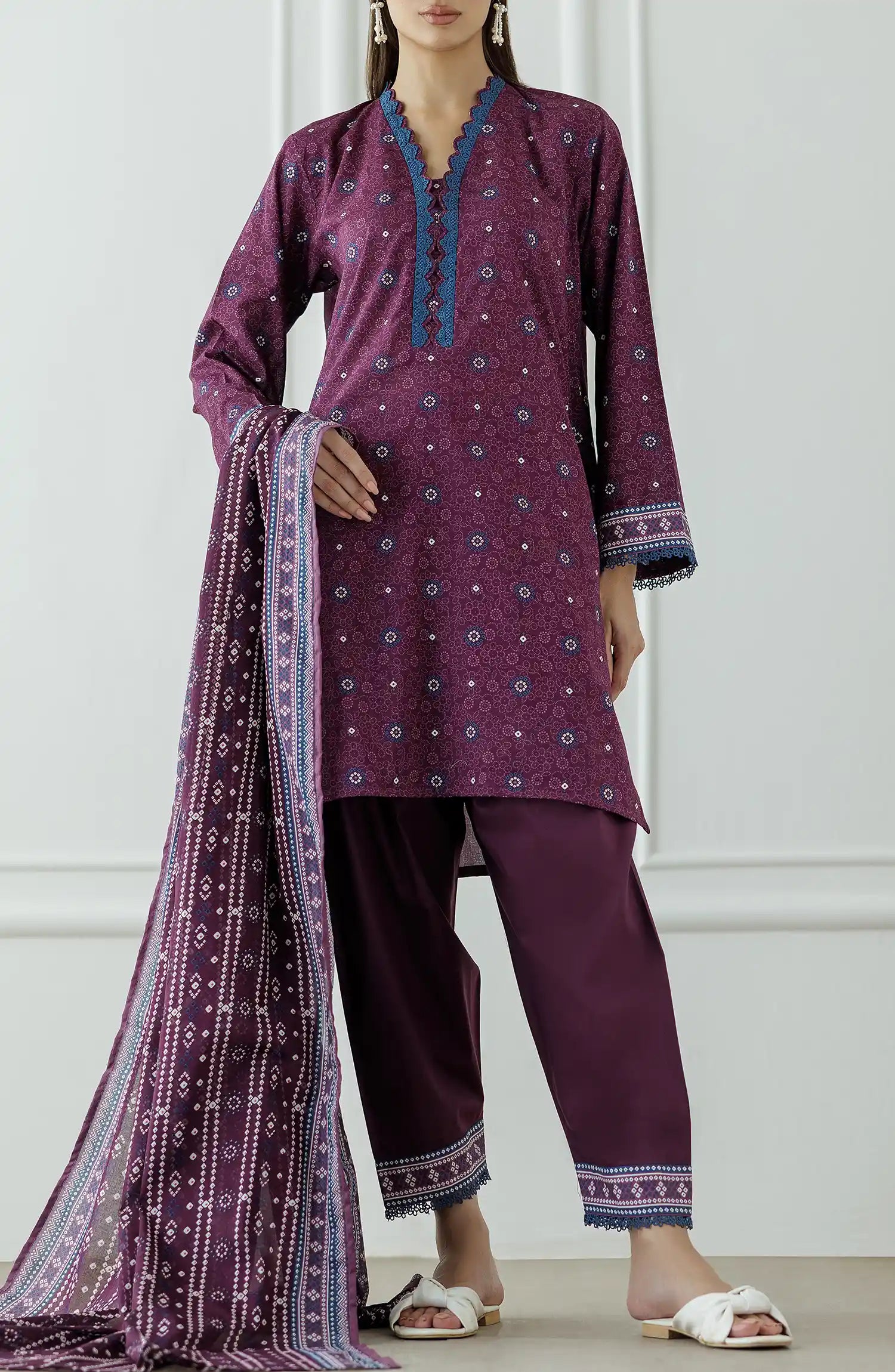 Woman wearing a purple traditional outfit with a matching dupatta against a dyed Trouser. Stitched Printed Lawn Shirt Dupatta & Pant - 3 Piece Suits - OTL-25-325