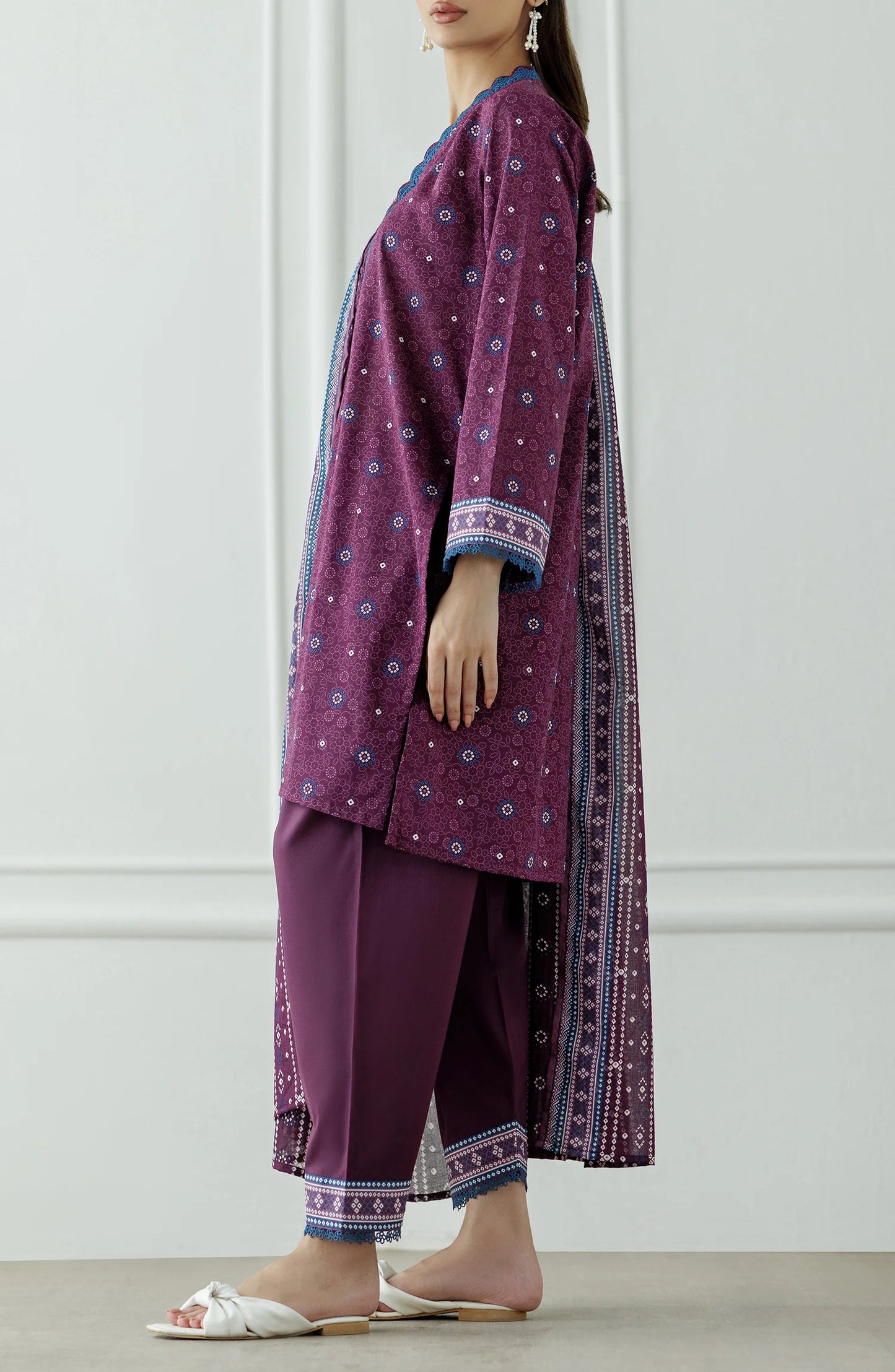 Woman wearing a purple traditional outfit with a matching dupatta against a dyed Trouser. Stitched Printed Lawn Shirt Dupatta & Pant - 3 Piece Suits - OTL-25-325