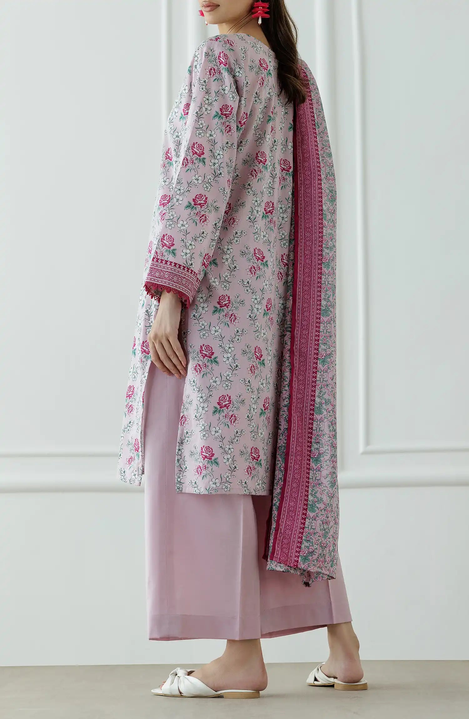 Woman wearing a floral kurta with pink border and matching pants against a dyed trouser. Stitched Printed Lawn Shirt Dupatta & Pant - 3 Piece Suits - OTL-25-337