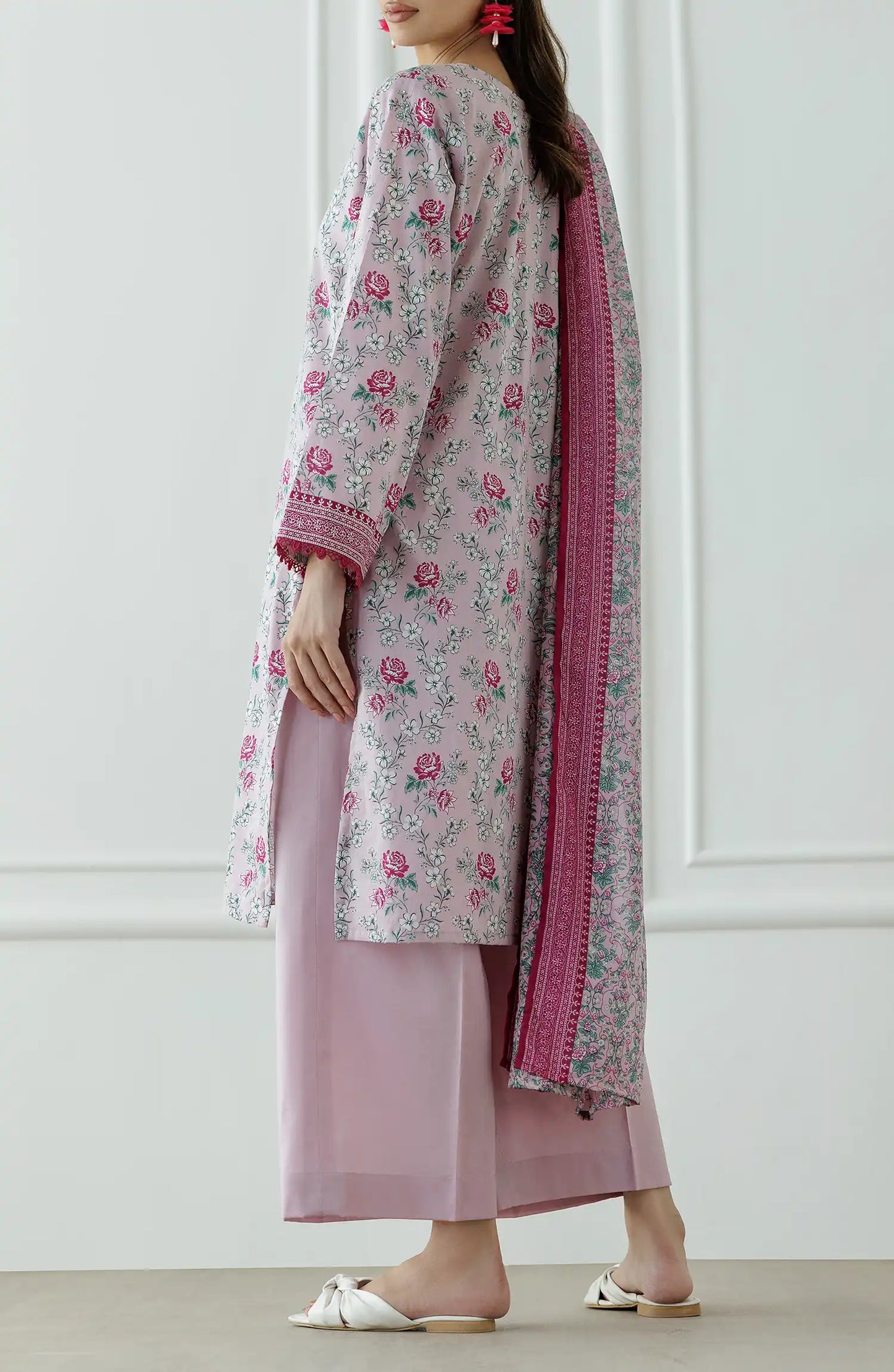 Woman wearing a floral kurta with pink border and matching pants against a dyed trouser. Stitched Printed Lawn Shirt Dupatta & Pant - 3 Piece Suits - OTL-25-337