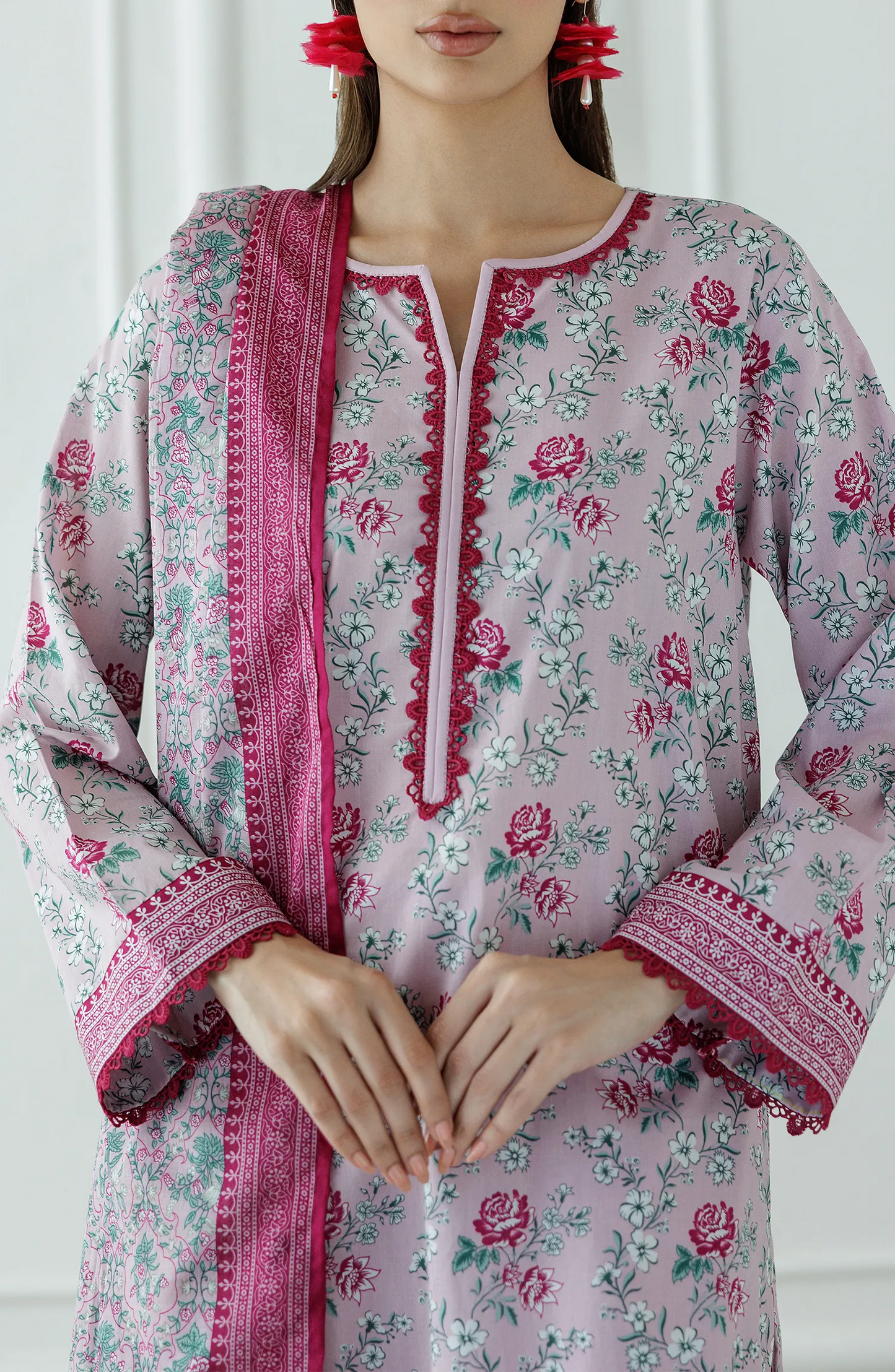 Woman wearing a floral kurta with pink border and matching pants against a dyed trouser. Stitched Printed Lawn Shirt Dupatta & Pant - 3 Piece Suits - OTL-25-337