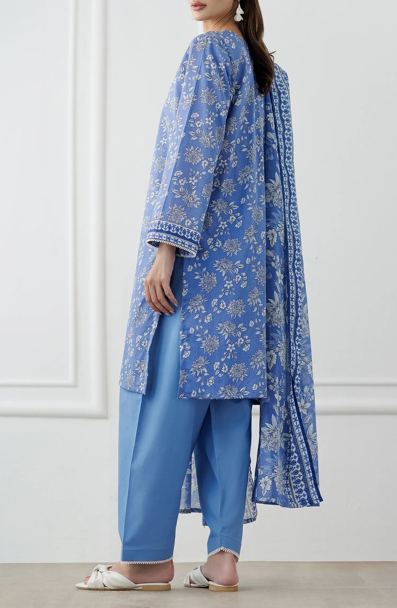 Woman wearing a blue embroidered outfit with a matching dupatta on a dyed trouser. Stitched Printed Lawn Shirt Dupatta & Pant - 3 Piece Suits - OTL-25-338