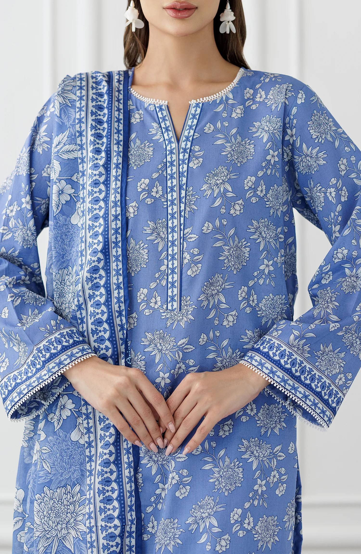 Woman wearing a blue embroidered outfit with a matching dupatta on a dyed trouser. Stitched Printed Lawn Shirt Dupatta & Pant - 3 Piece Suits - OTL-25-338
