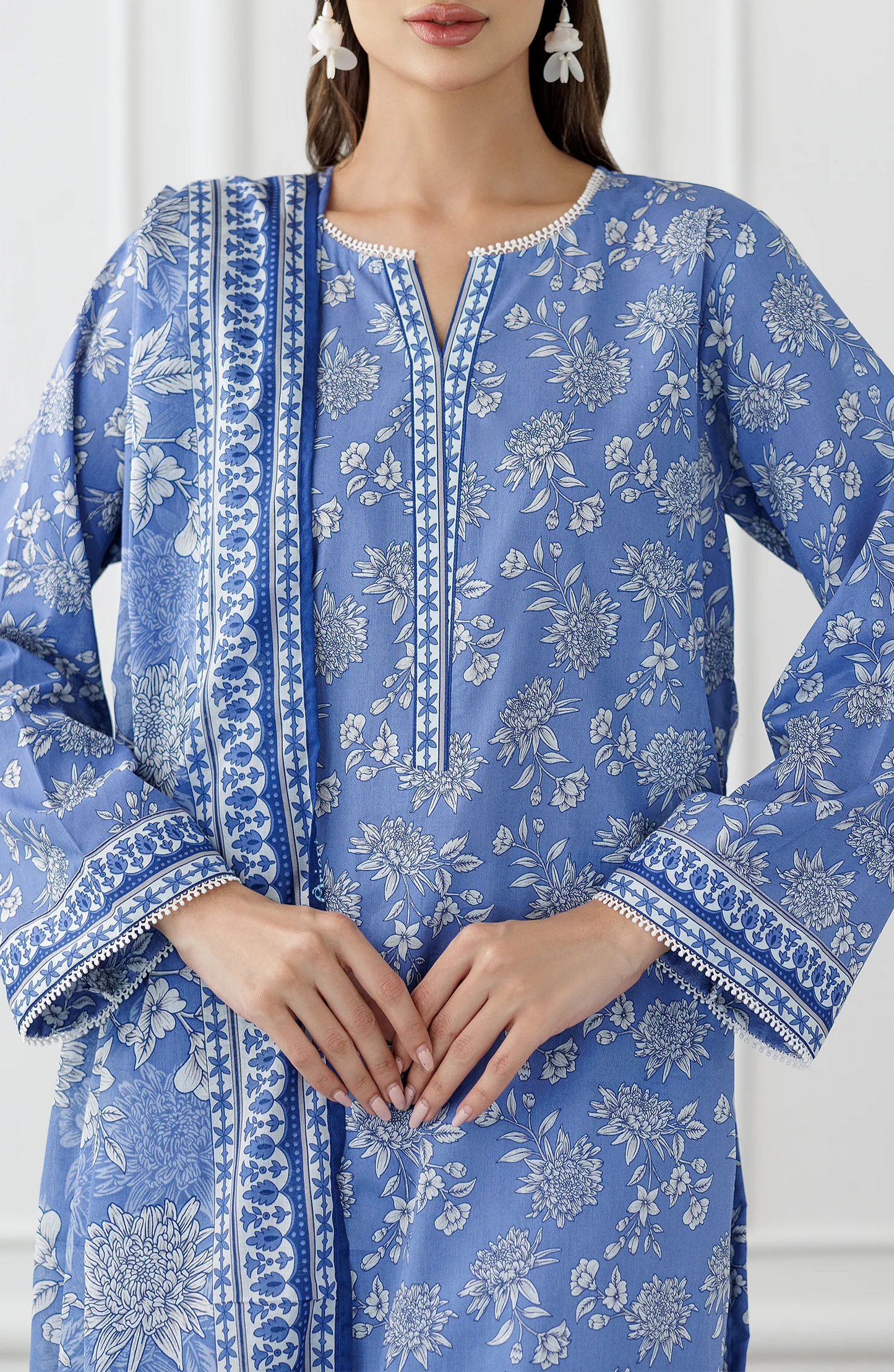 Woman wearing a blue embroidered outfit with a matching dupatta on a dyed trouser. Stitched Printed Lawn Shirt Dupatta & Pant - 3 Piece Suits - OTL-25-338