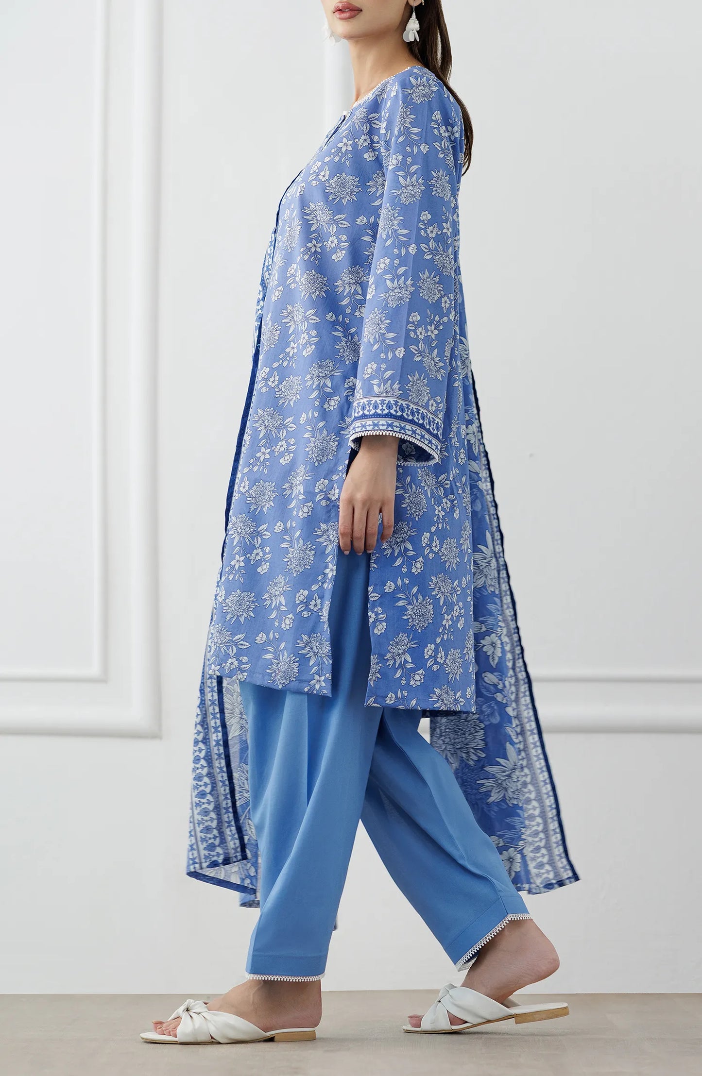 Woman wearing a blue embroidered outfit with a matching dupatta on a dyed trouser. Stitched Printed Lawn Shirt Dupatta & Pant - 3 Piece Suits - OTL-25-338