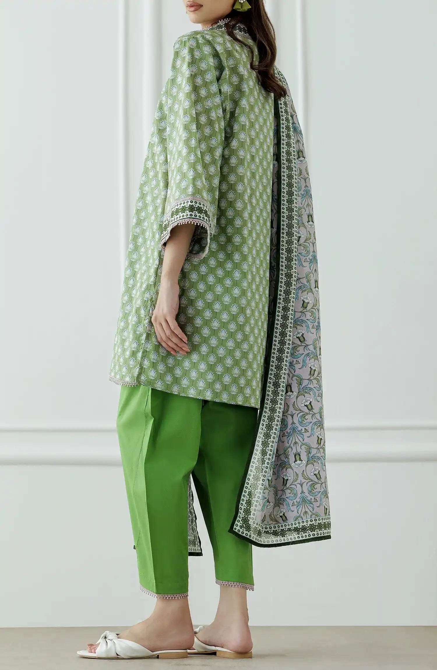 Woman wearing a green and white patterned outfit with a matching dupatta on a plain shalwar. Unstitched Printed Lawn Shirt Dupatta & Pant - 3 Piece Suits - OTL-25-339