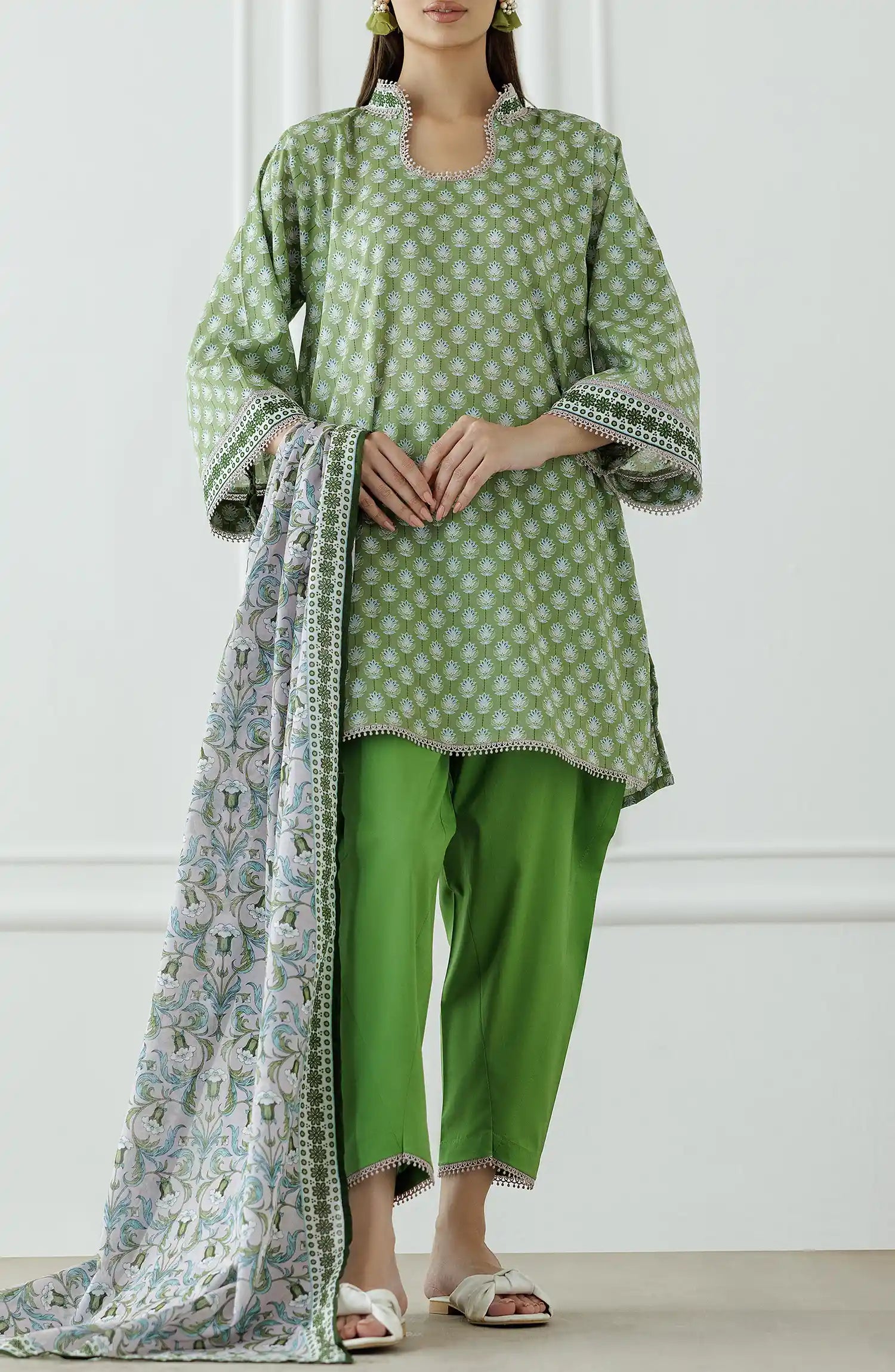 Woman wearing a green and white patterned outfit with a matching dupatta on a plain shalwar. Unstitched Printed Lawn Shirt Dupatta & Pant - 3 Piece Suits - OTL-25-339