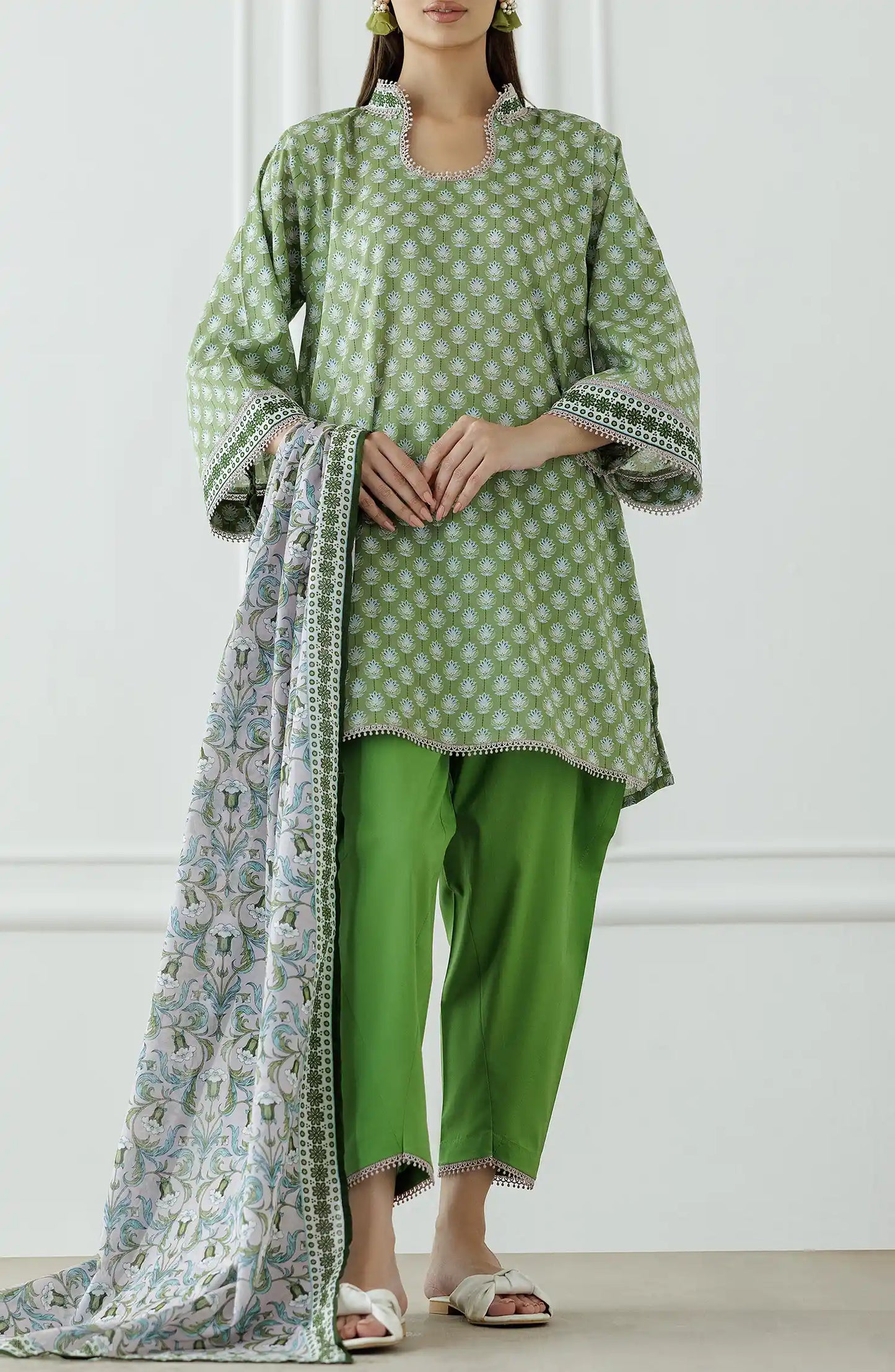 Woman wearing a green and white patterned outfit with a matching dupatta on a plain shalwar. Unstitched Printed Lawn Shirt Dupatta & Pant - 3 Piece Suits - OTL-25-339