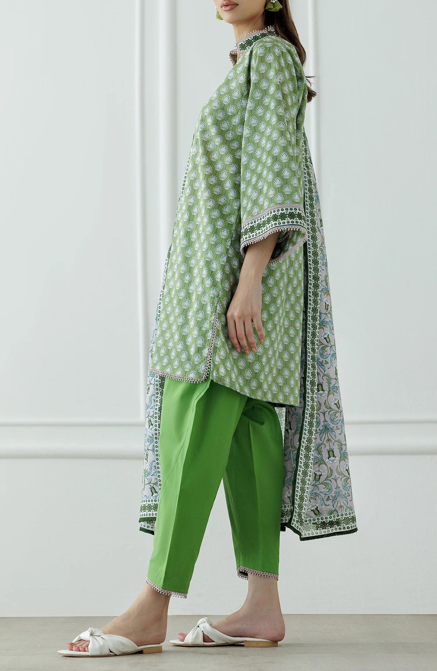 Woman wearing a green and white patterned outfit with a matching dupatta on a plain shalwar. Unstitched Printed Lawn Shirt Dupatta & Pant - 3 Piece Suits - OTL-25-339