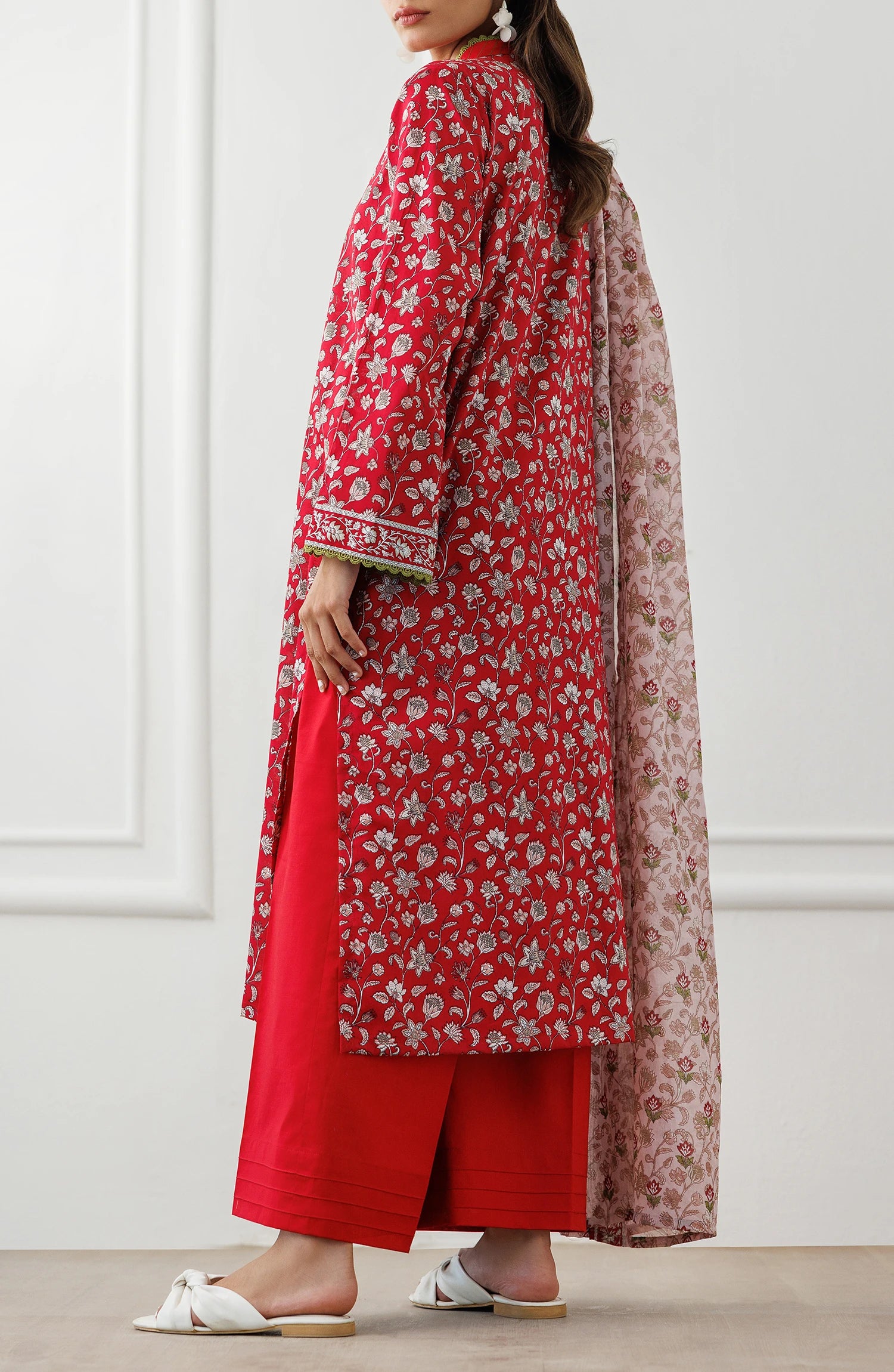 Woman wearing a red floral kurta with red pants and a matching dupatta on a matching trouser. Unstitched Printed Lawn Shirt Dupatta & Pant - 3 Piece Suits - OTL-25-344