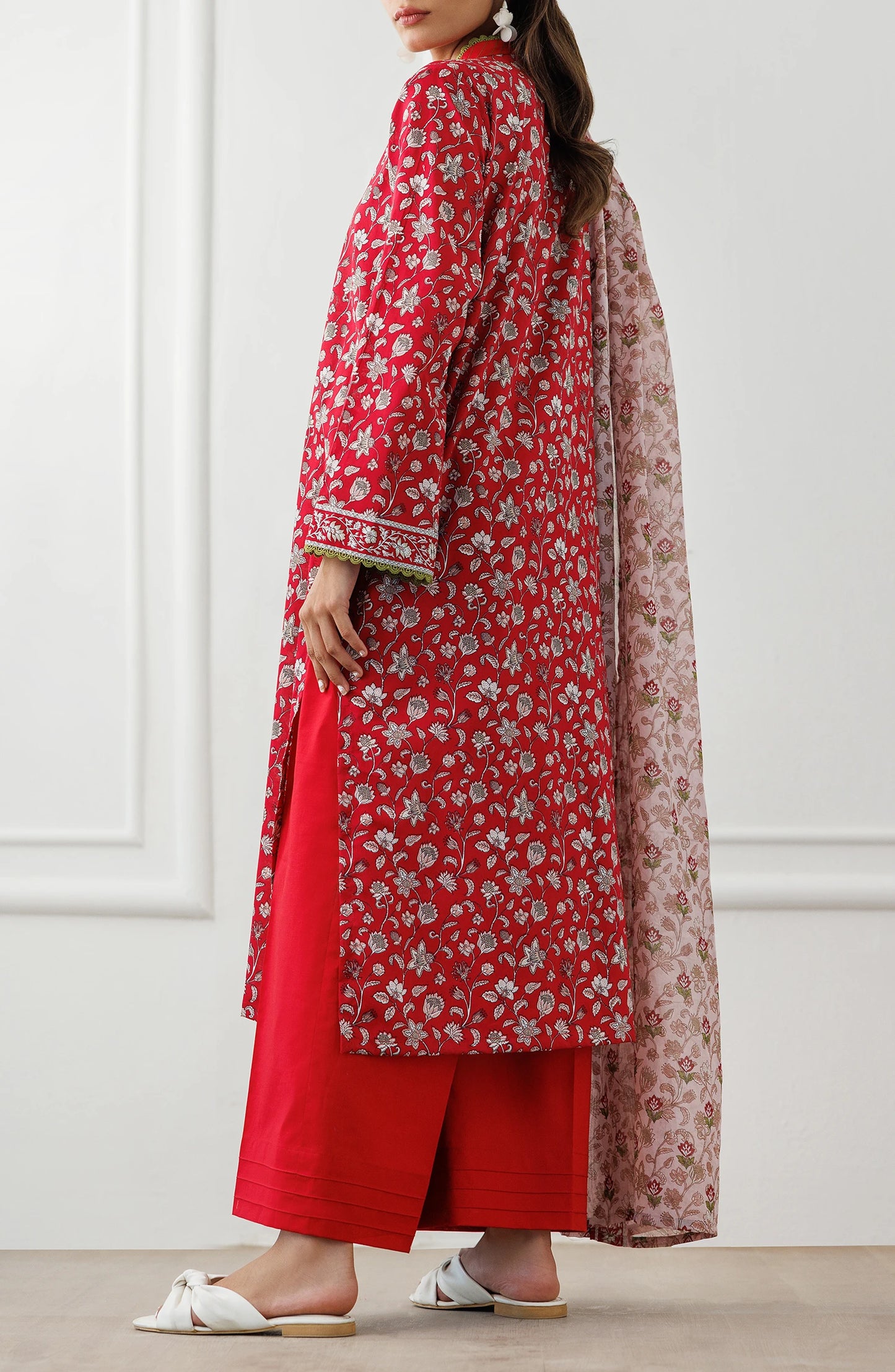 Woman wearing a red floral kurta with red pants and a matching dupatta on a matching trouser. Unstitched Printed Lawn Shirt Dupatta & Pant - 3 Piece Suits - OTL-25-344