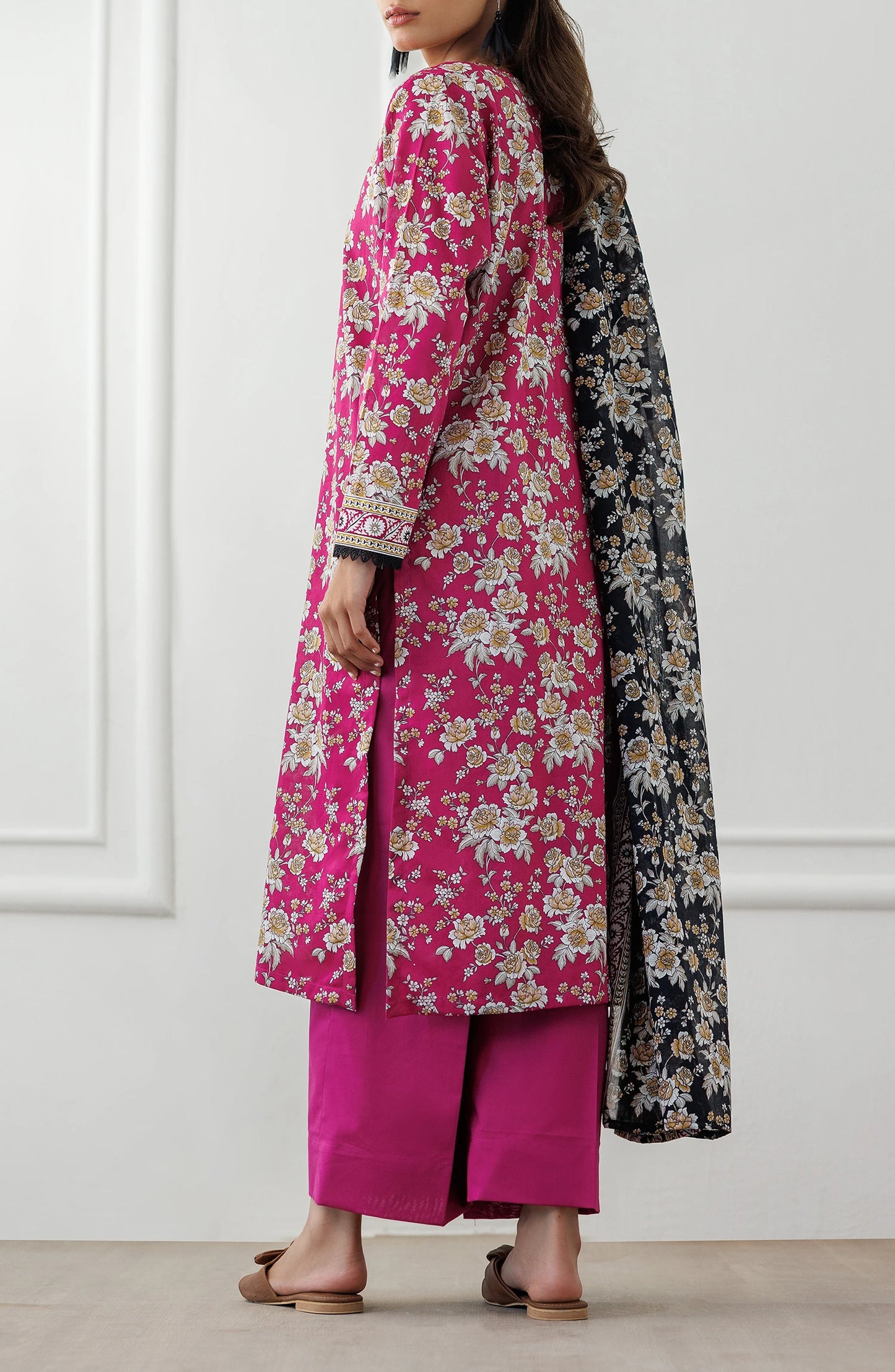 Woman wearing a pink floral kurta with matching pants and a black floral dupatta on a dyed plain trouser. Unstitched Printed Lawn Shirt Dupatta & Pant - 3 Piece Suits - OTL-25-346