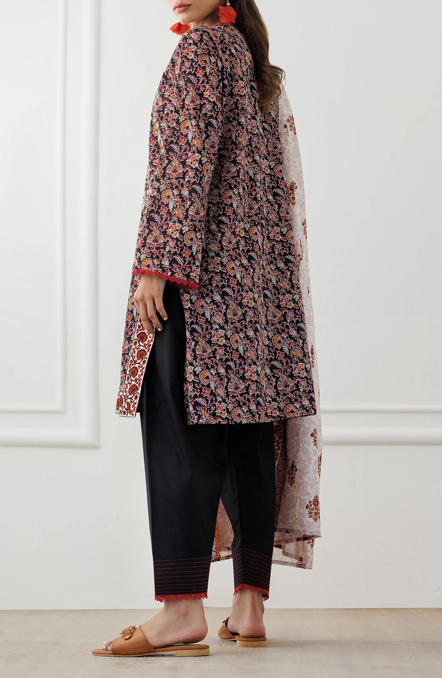 Woman wearing a floral kurta with a matching dupatta on a black dyed shalwar. Unstitched Printed Lawn Shirt Dupatta & Pant - 3 Piece Suits - OTL-25-348
