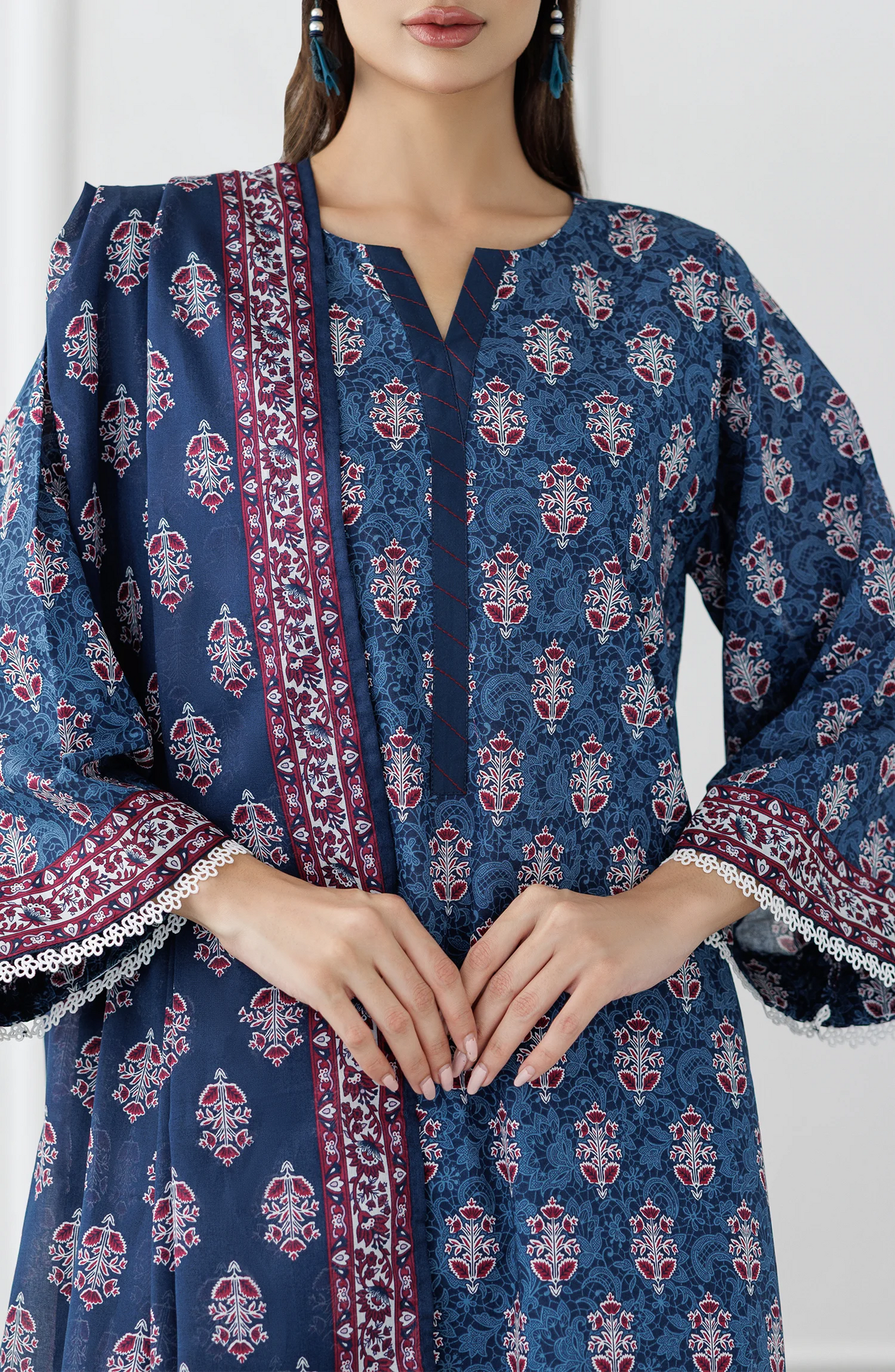 Woman wearing a blue patterned outfit with a matching dupatta on a dyed trouser. Stitched Printed Lawn Shirt Dupatta & Pant - 3 Piece Suits - OTL-25-353