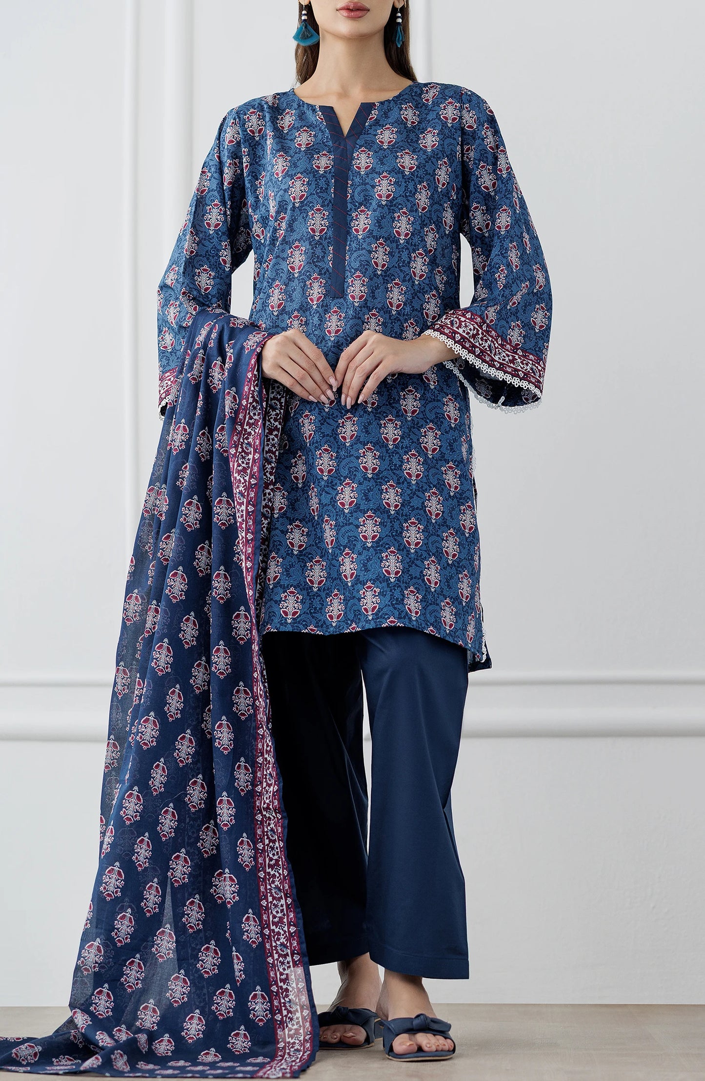Woman wearing a blue patterned outfit with a matching dupatta on a dyed trouser. Stitched Printed Lawn Shirt Dupatta & Pant - 3 Piece Suits - OTL-25-353