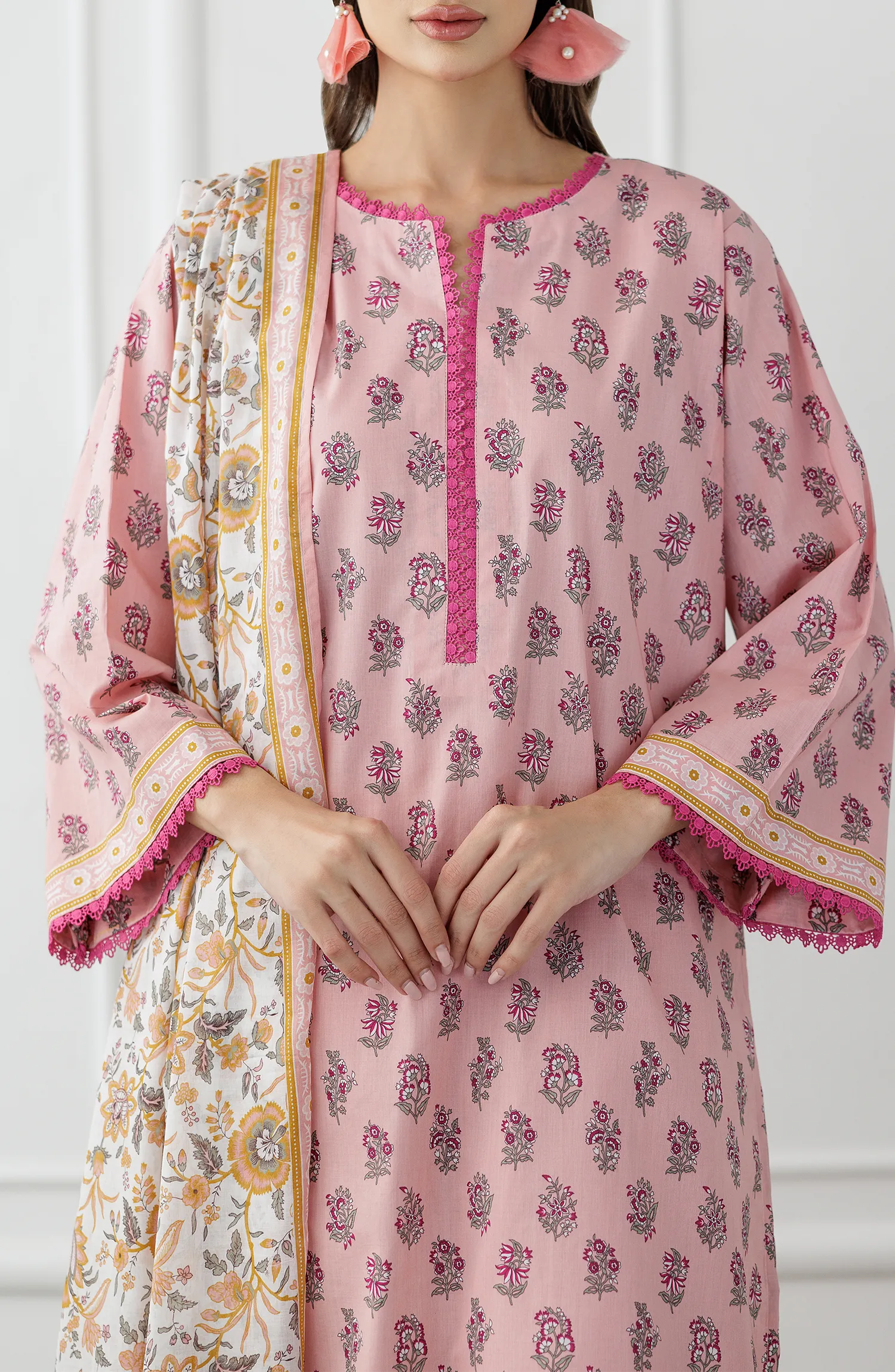 Woman wearing a pink traditional outfit with a matching dupatta on a dyed trouser. Stitched Printed Lawn Shirt Dupatta & Pant - 3 Piece Suits - OTL-25-358