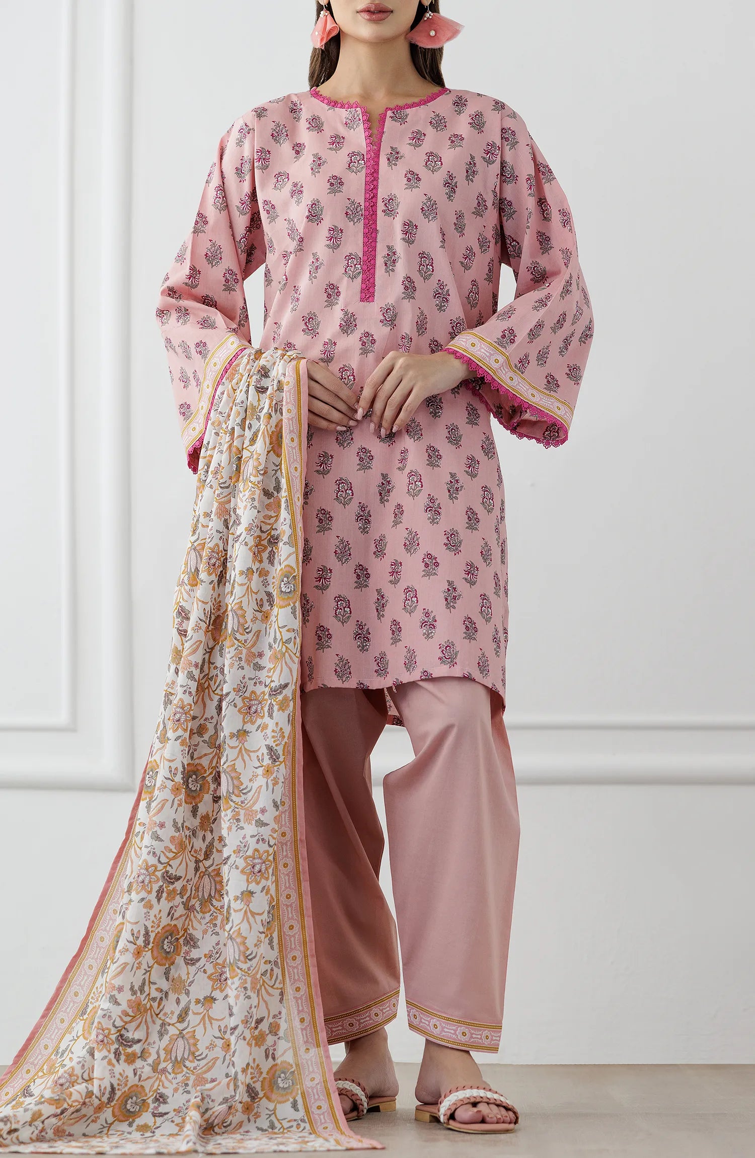 Woman wearing a pink traditional outfit with a matching dupatta on a dyed trouser. Stitched Printed Lawn Shirt Dupatta & Pant - 3 Piece Suits - OTL-25-358