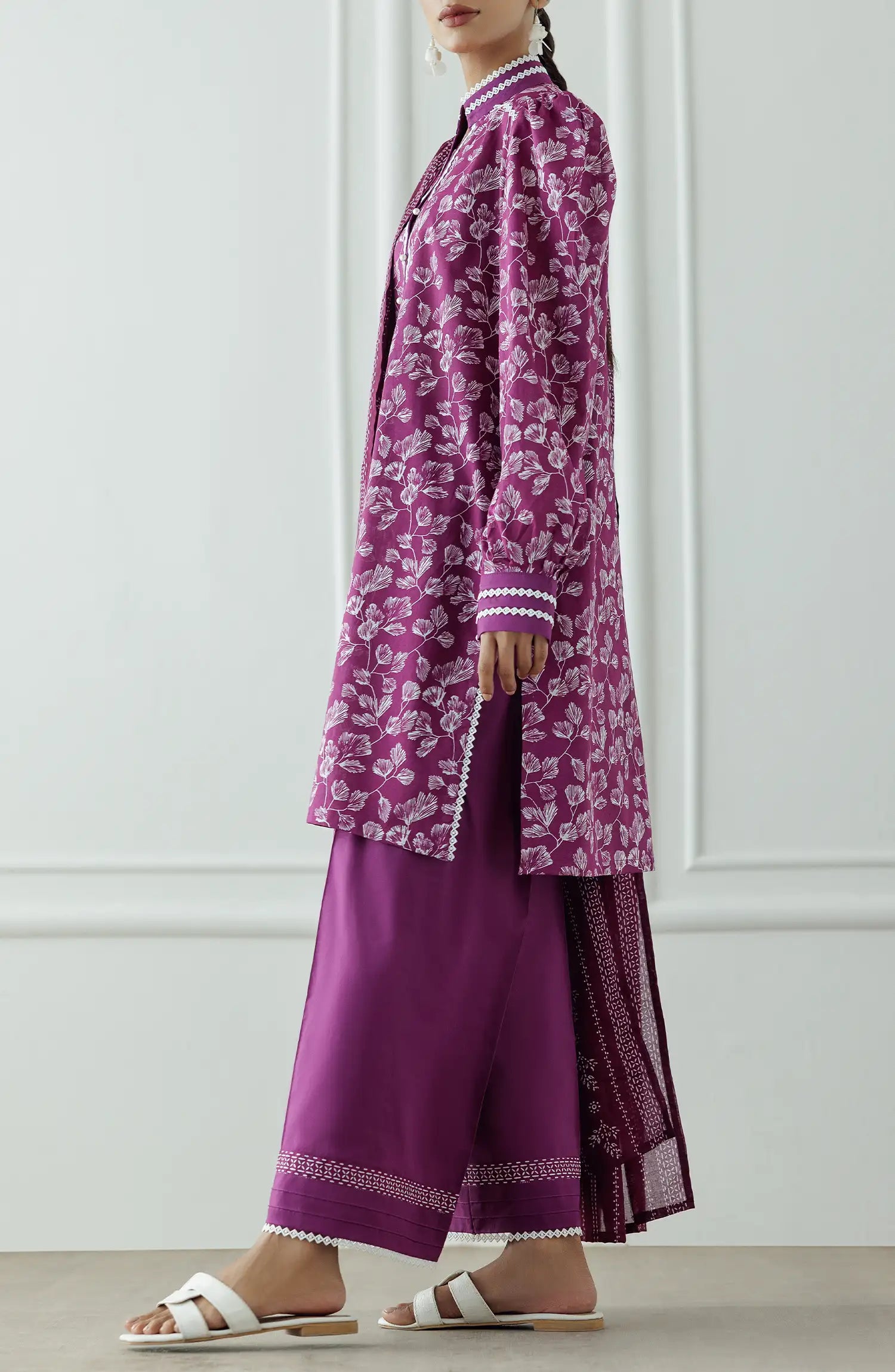 Women wearing a purple dress with white floral pattern and pearl details and dyed trouser. Stitched Printed Lawn Shirt Dupatta & Pant - 3 Piece Suits - OTL-25-378