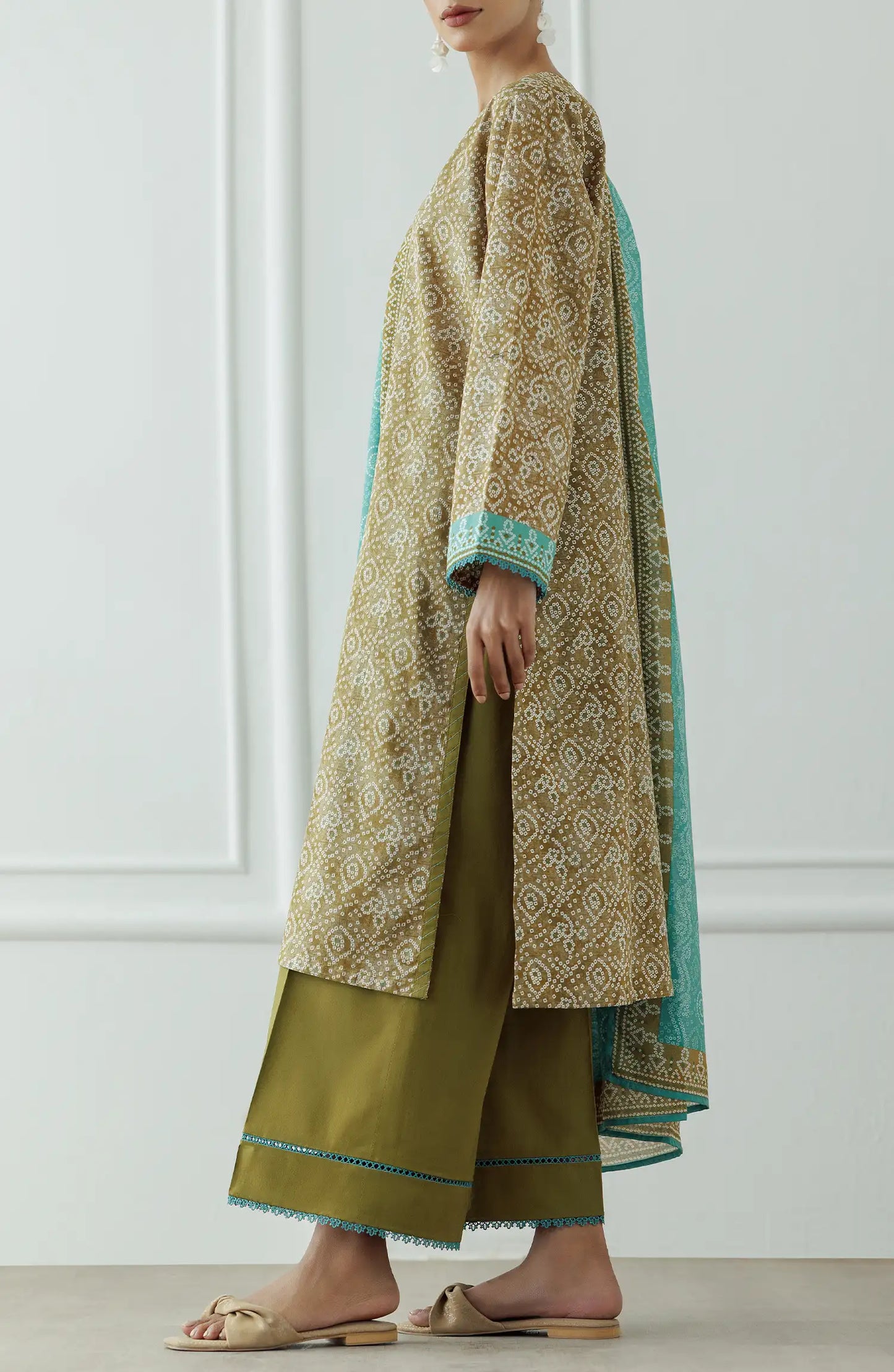 Woman wearing a patterned kurta with green dupatta against a dyed trouser. Stitched Printed Lawn Shirt Dupatta & Pant - 3 Piece Suits - OTL-25-408