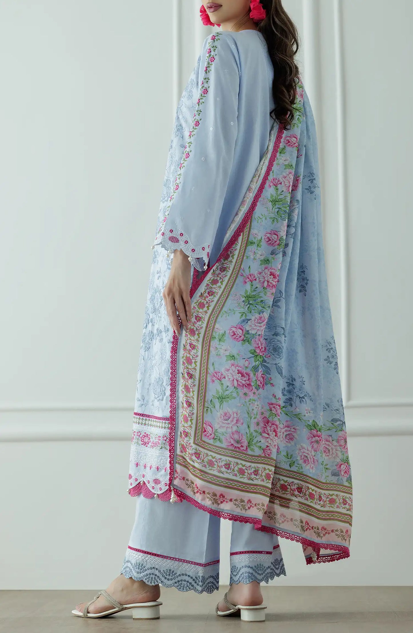Woman wearing a light blue embroidered outfit with a floral dupatta against a dyed trouser. Stitched Luxury Premium Embroidered Lawn Shirt Dupatta & Pant - 3 Piece Suits - WRC25S-3008