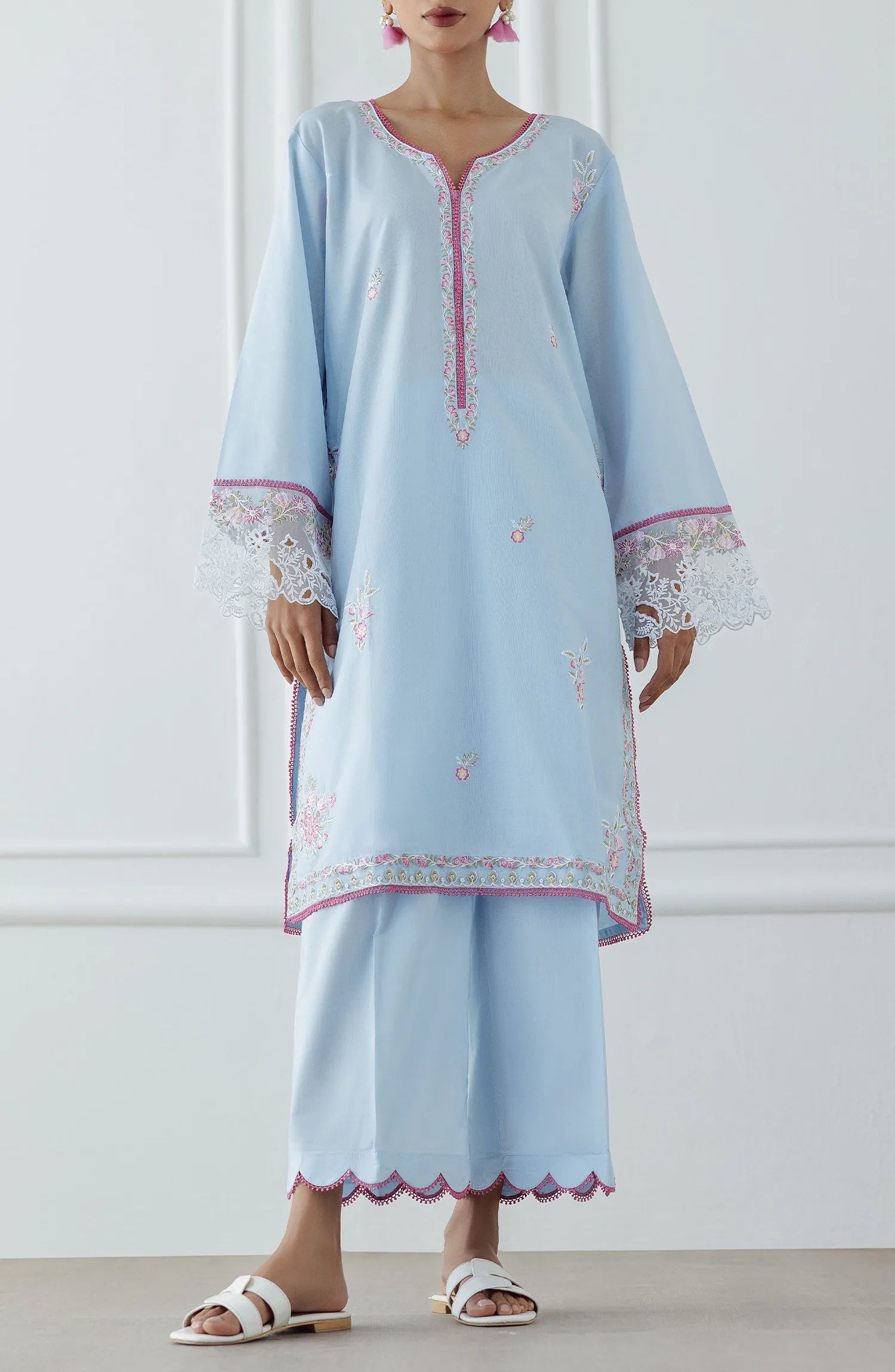 Women wearing a Light blue dress with intricate embroidery on a dyed trouser. Stitched Luxury Premium Embroidered Lawn Shirt & Pant - 2 Piece Suits (Co-ord Set) - WRCJ25S-2007