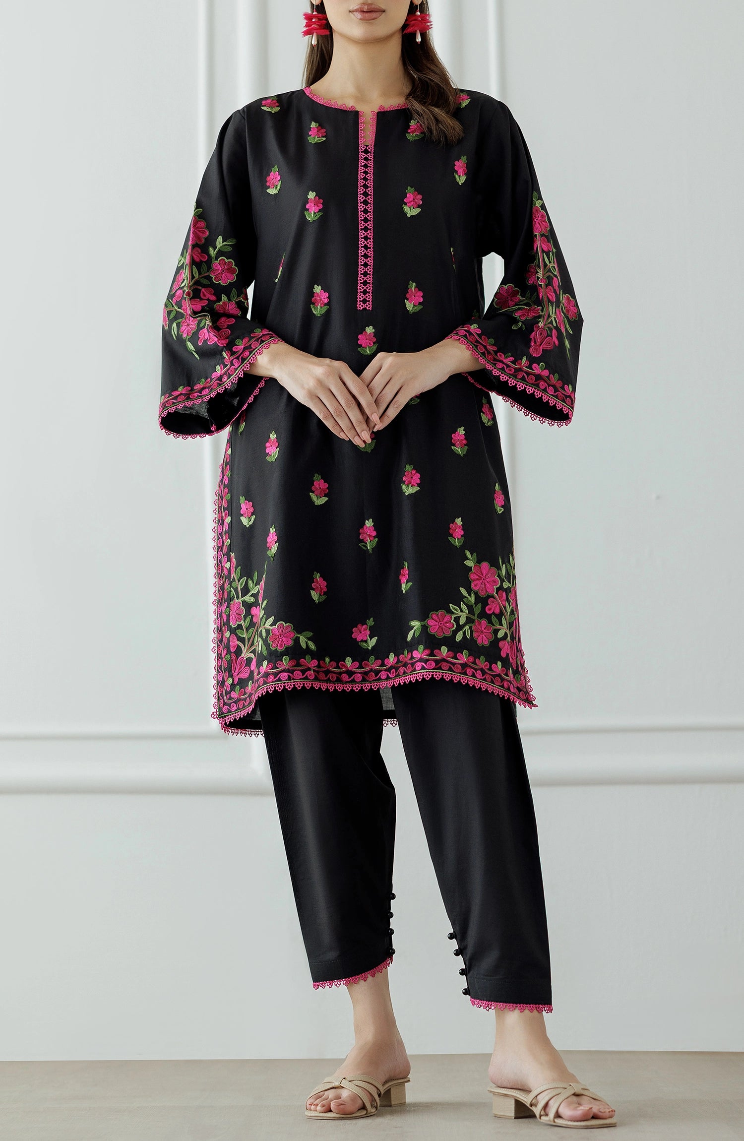 Women wearing a Black embroidered kurta with pink floral patterns worn against a dyed trouser. Stitched Luxury Premium Embroidered Lawn Shirt & Pant - 2 Piece Suits (Co-ord Set) - WRCJ25S-2012