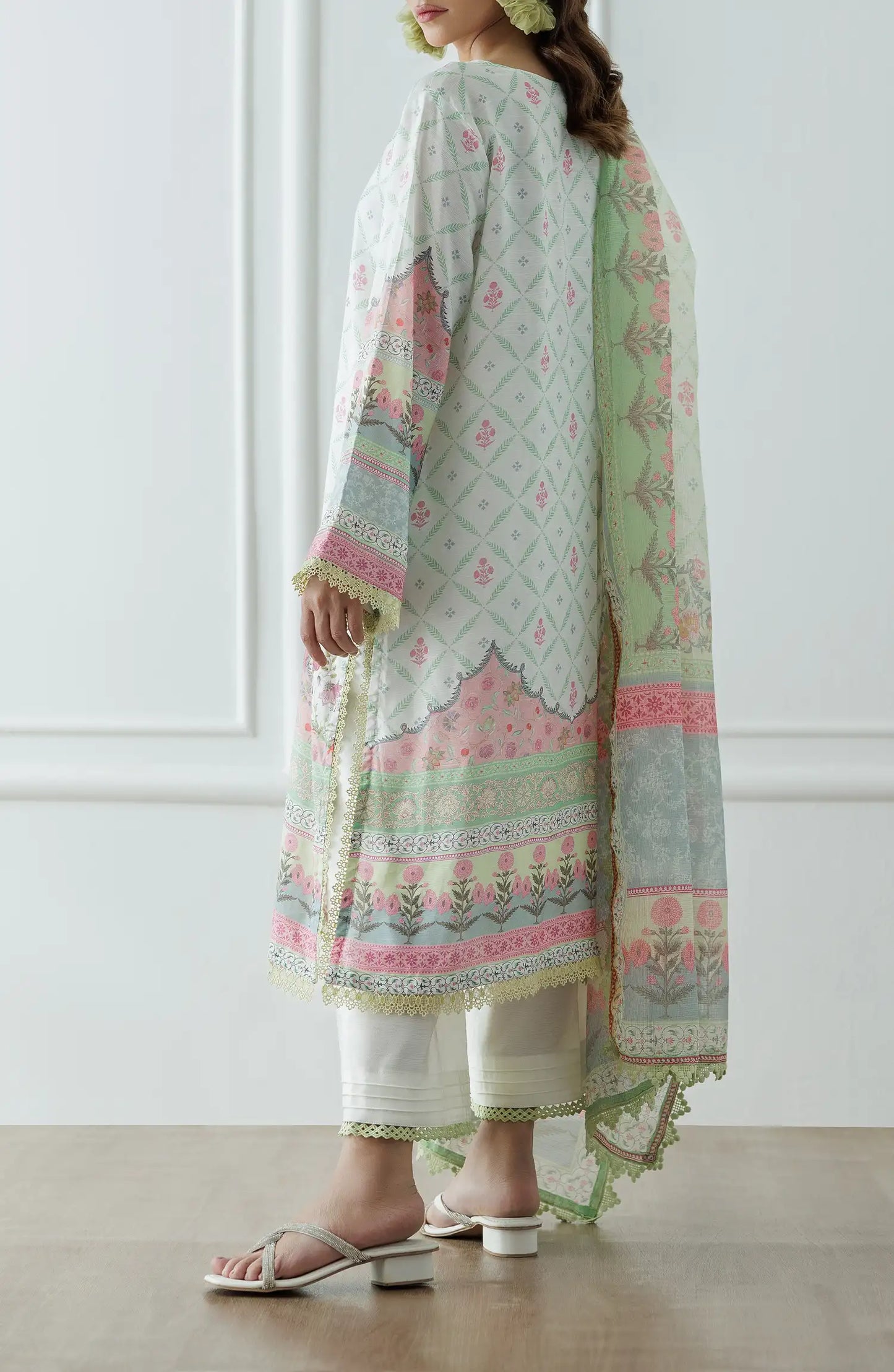 Woman wearing a floral embroidered outfit with a light green dupatta on a dyed lace detail culottes. Stitched Premium Printed Raw Silk Shirt Dupatta & Pant - 3 Piece - WRCR24S-3001