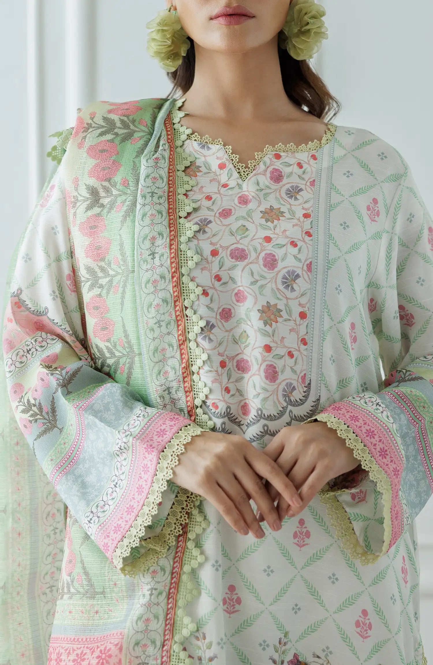 Woman wearing a floral embroidered outfit with a light green dupatta on a dyed lace detail culottes. Stitched Premium Printed Raw Silk Shirt Dupatta & Pant - 3 Piece - WRCR24S-3001