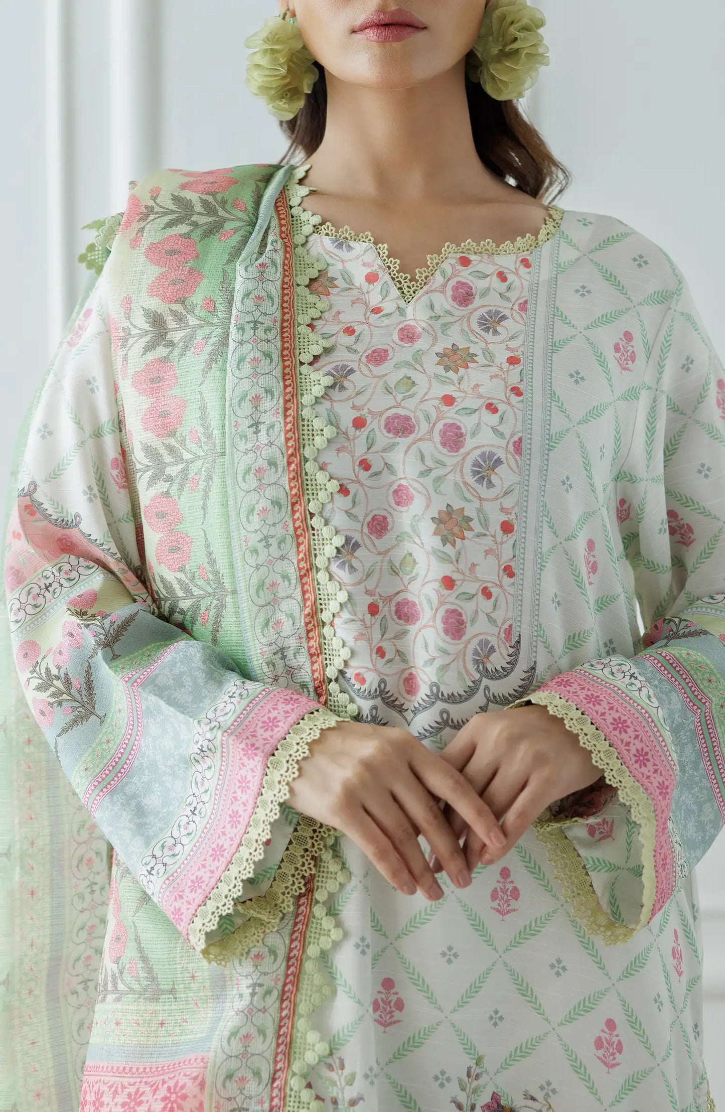 Woman wearing a floral embroidered outfit with a light green dupatta on a dyed lace detail culottes. Stitched Premium Printed Raw Silk Shirt Dupatta & Pant - 3 Piece - WRCR24S-3001