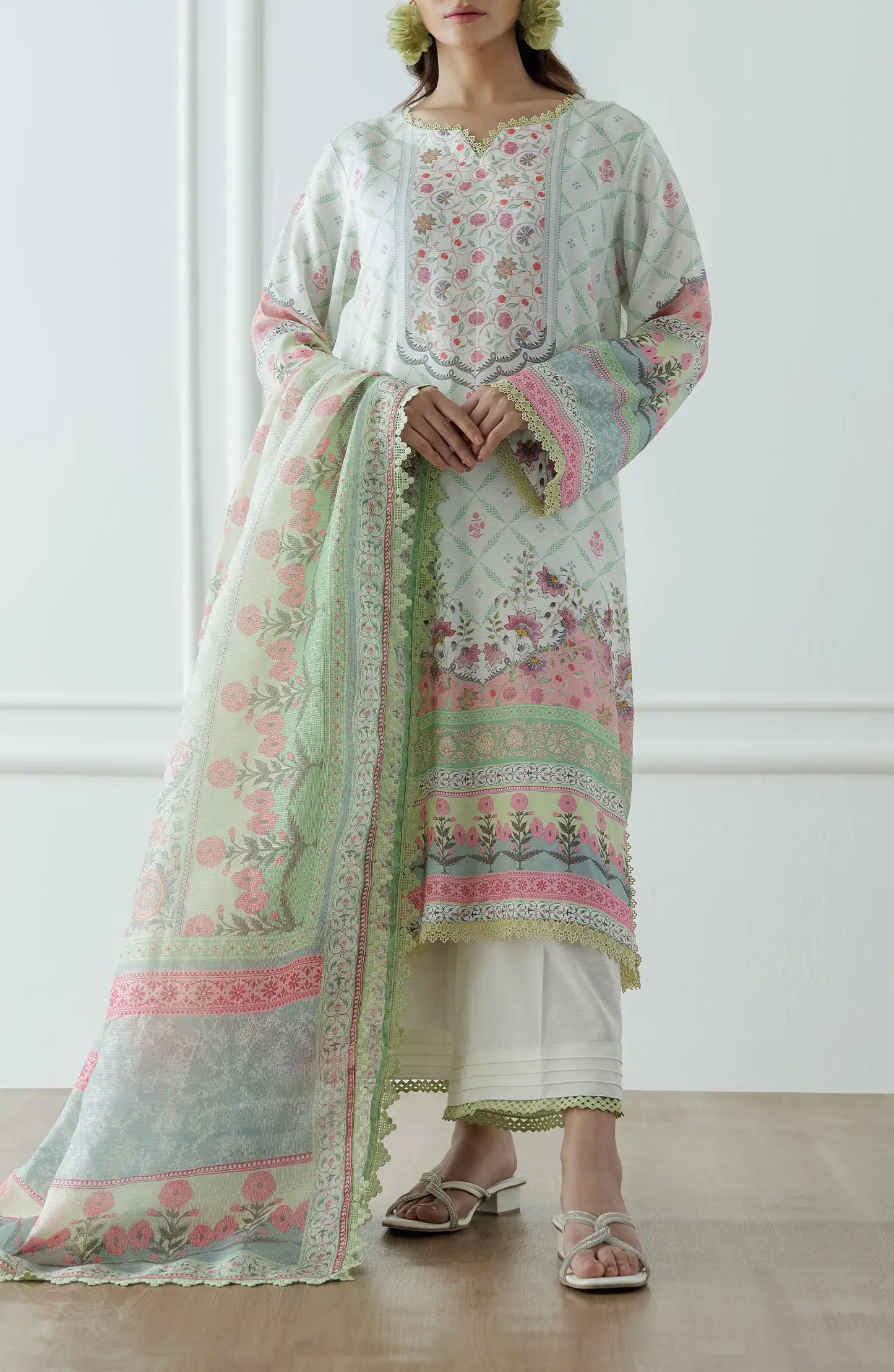 Woman wearing a floral embroidered outfit with a light green dupatta on a dyed lace detail culottes. Stitched Premium Printed Raw Silk Shirt Dupatta & Pant - 3 Piece - WRCR24S-3001