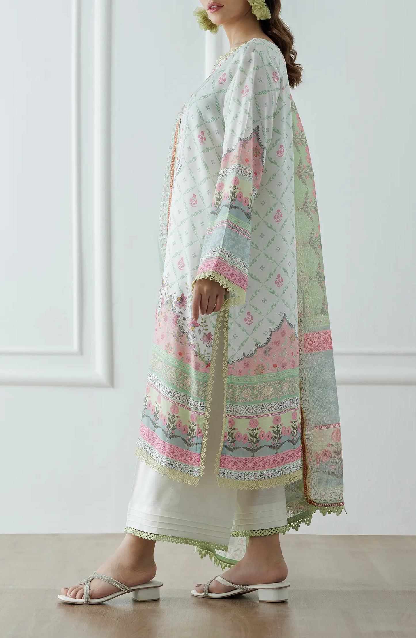 Woman wearing a floral embroidered outfit with a light green dupatta on a dyed lace detail culottes. Stitched Premium Printed Raw Silk Shirt Dupatta & Pant - 3 Piece - WRCR24S-3001