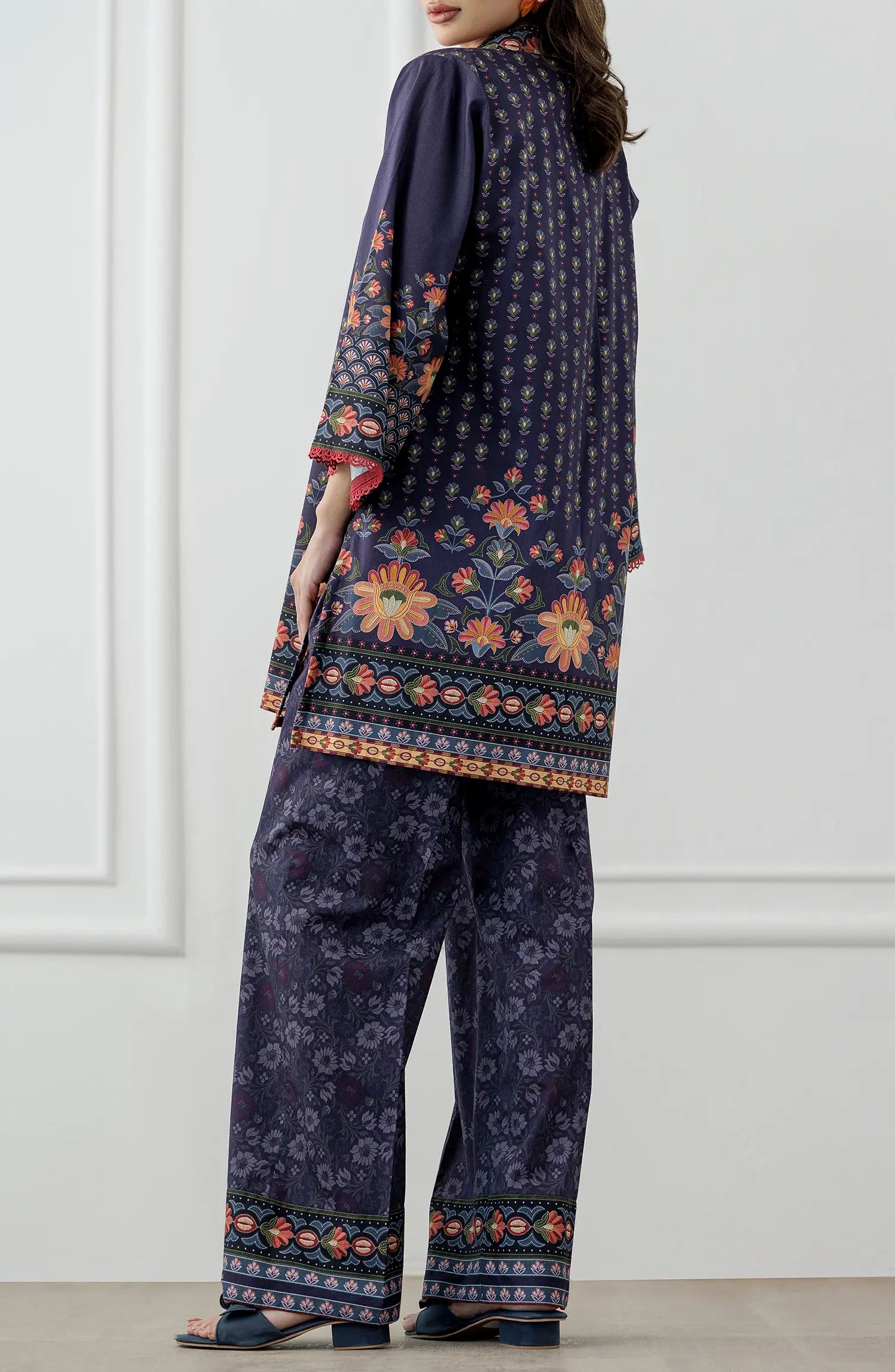Women wearing a Navy blue patterned shirt and pants set. Stitched Printed Lawn Shirt & Pant - 2 Piece Suits (Co-ord Set) - WRCV25S-2006